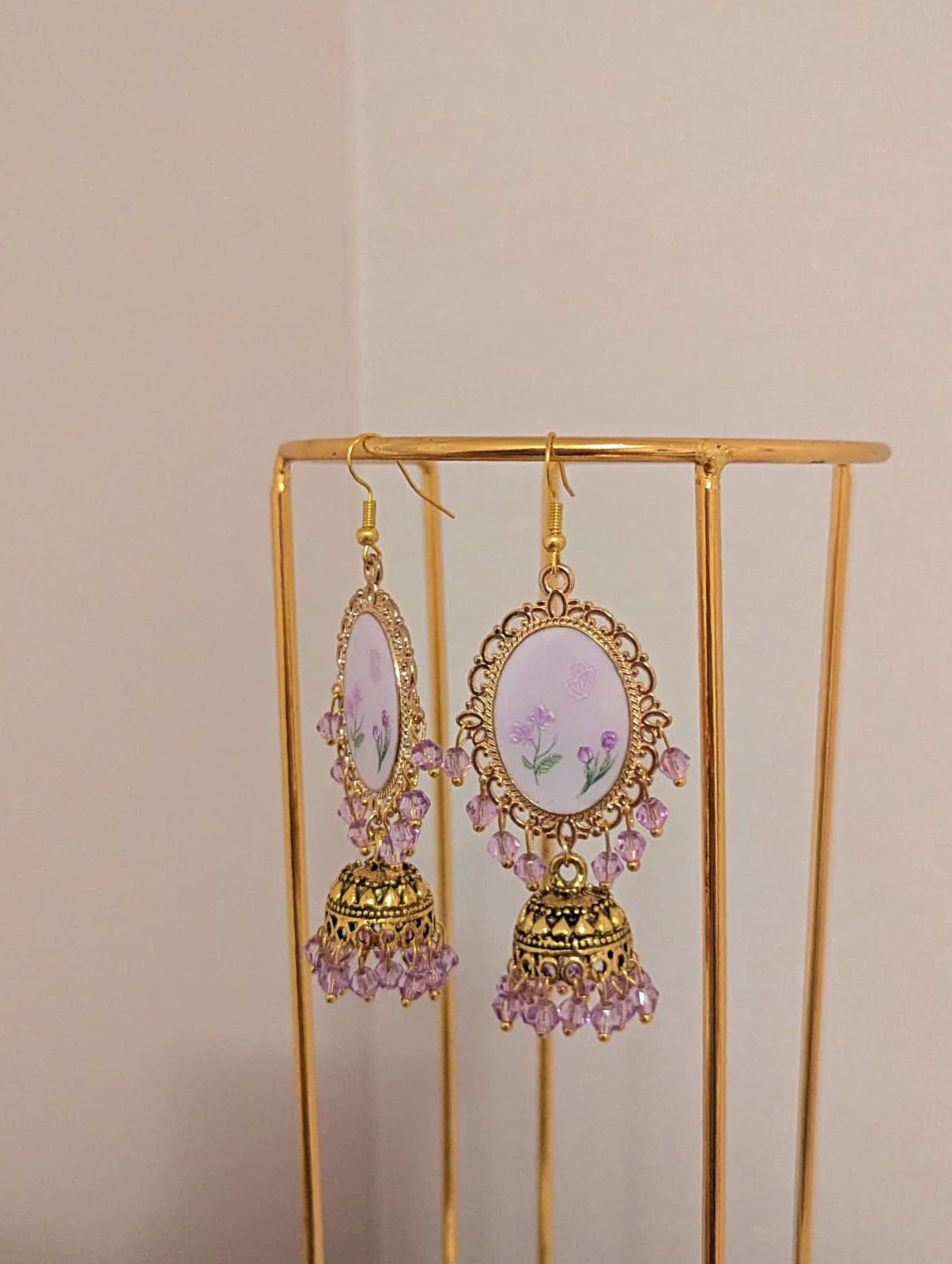 Purple on purple floral jhumkay drop earrings in gold