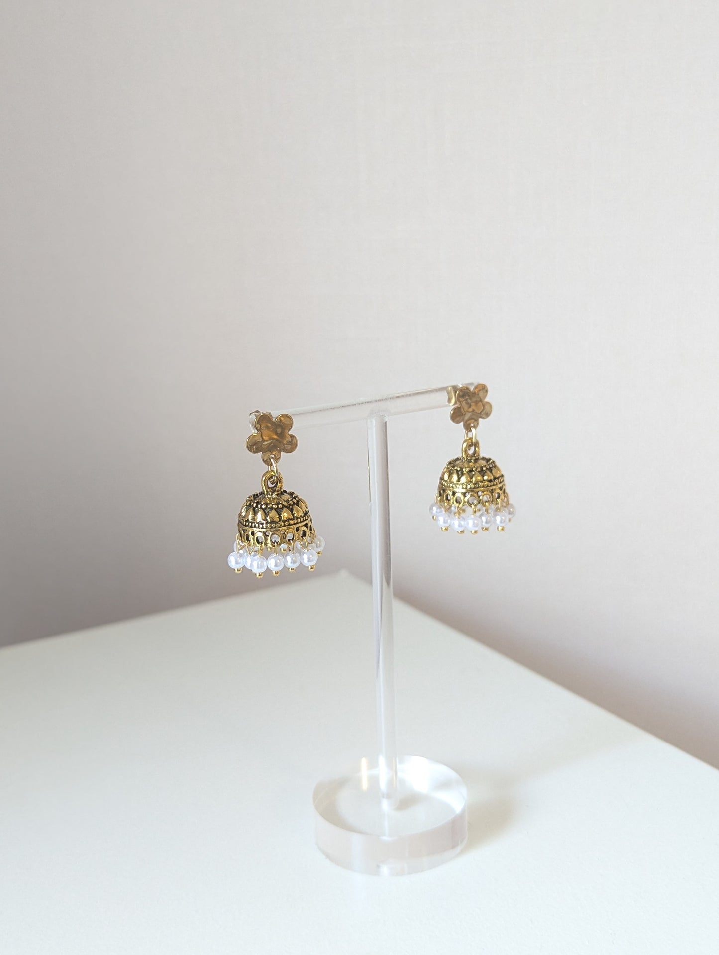 Gold floral jhumka with white pearls