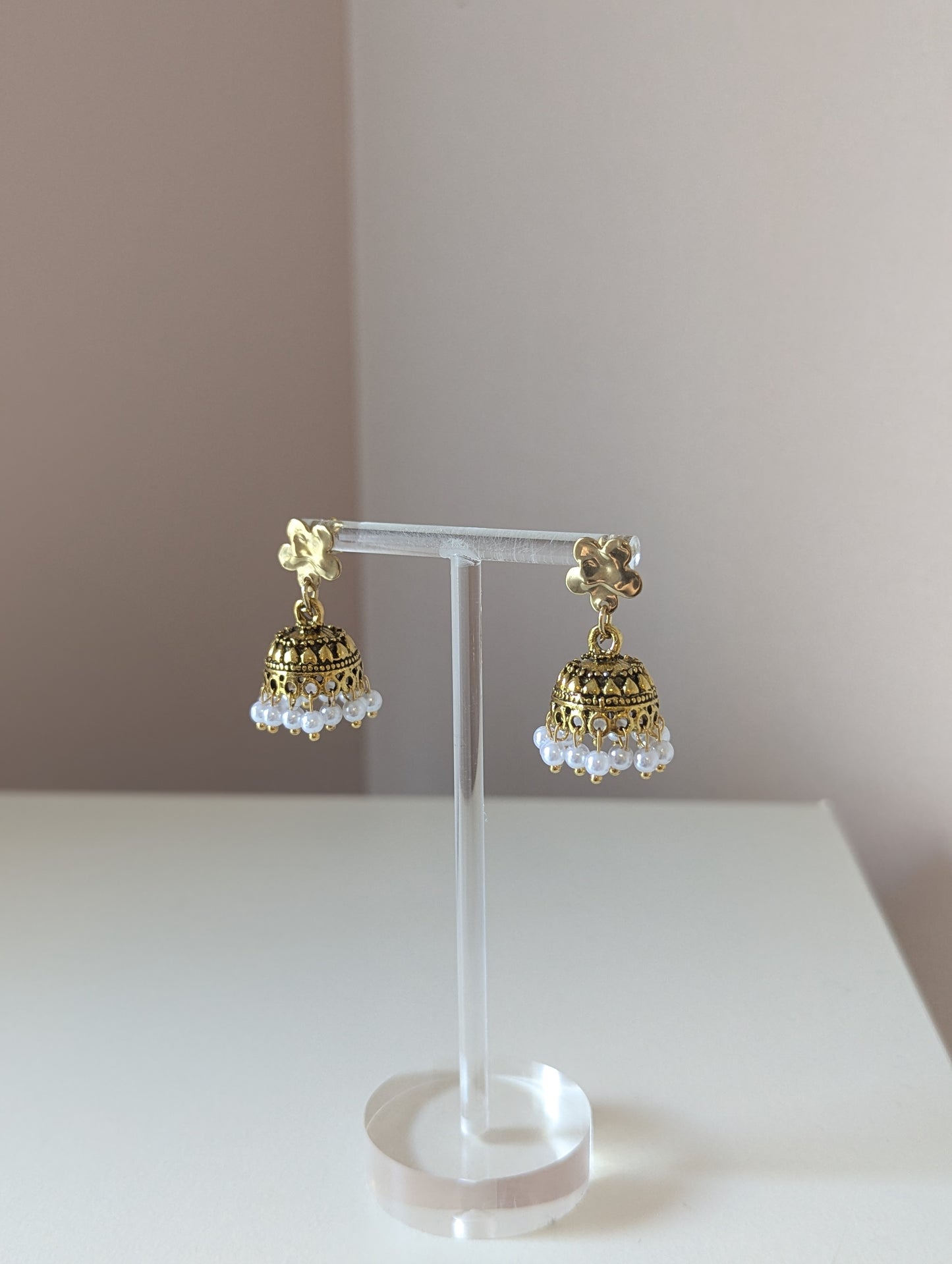 Gold floral jhumka with white pearls