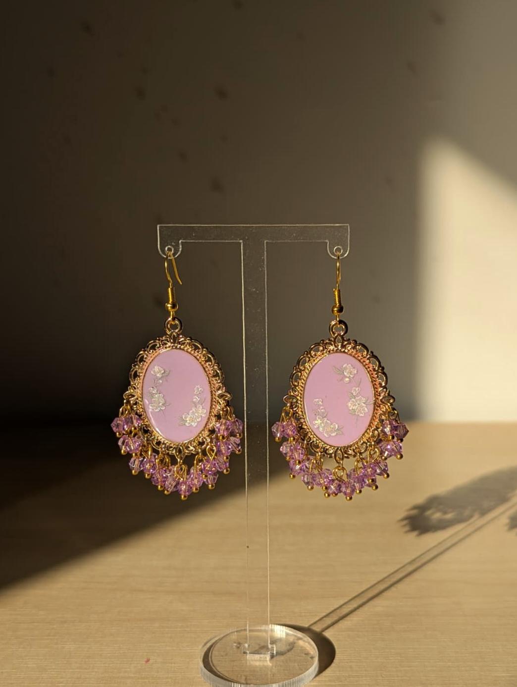 Purple floral resin earrings in gold