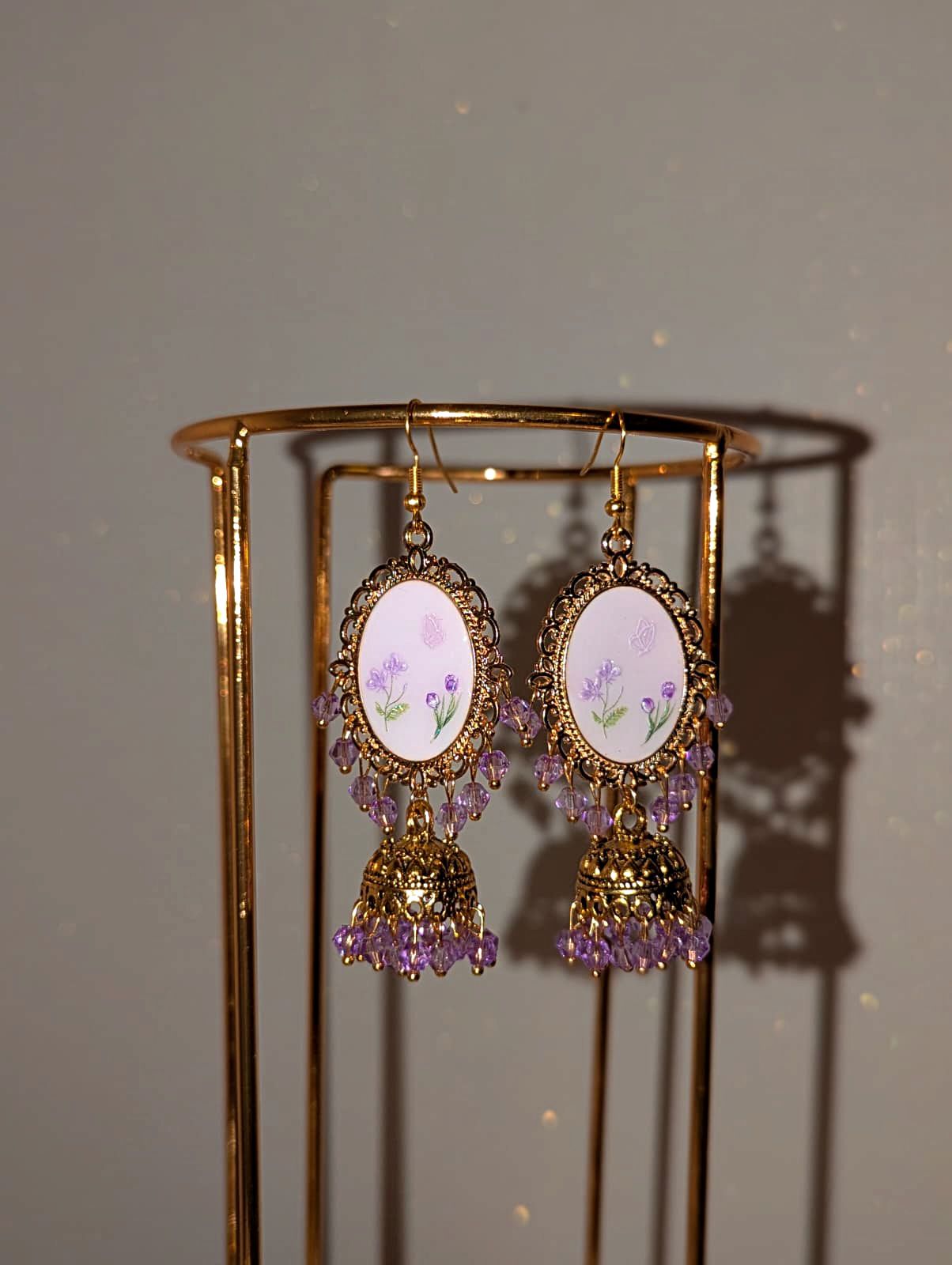 Purple on purple floral jhumkay drop earrings in gold