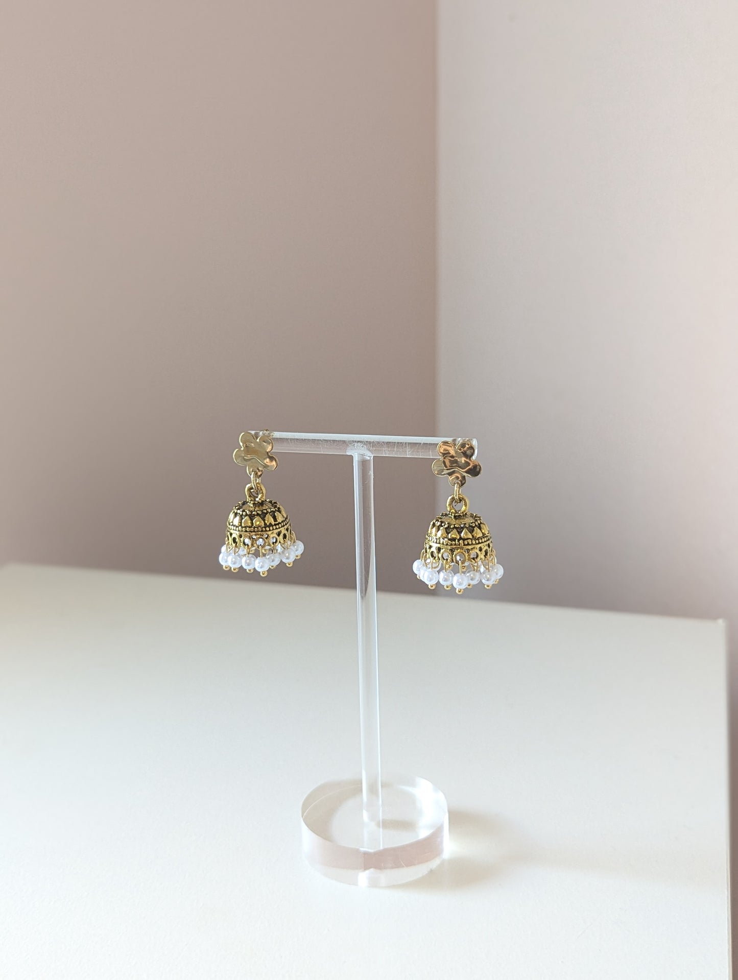 Gold floral jhumka with white pearls