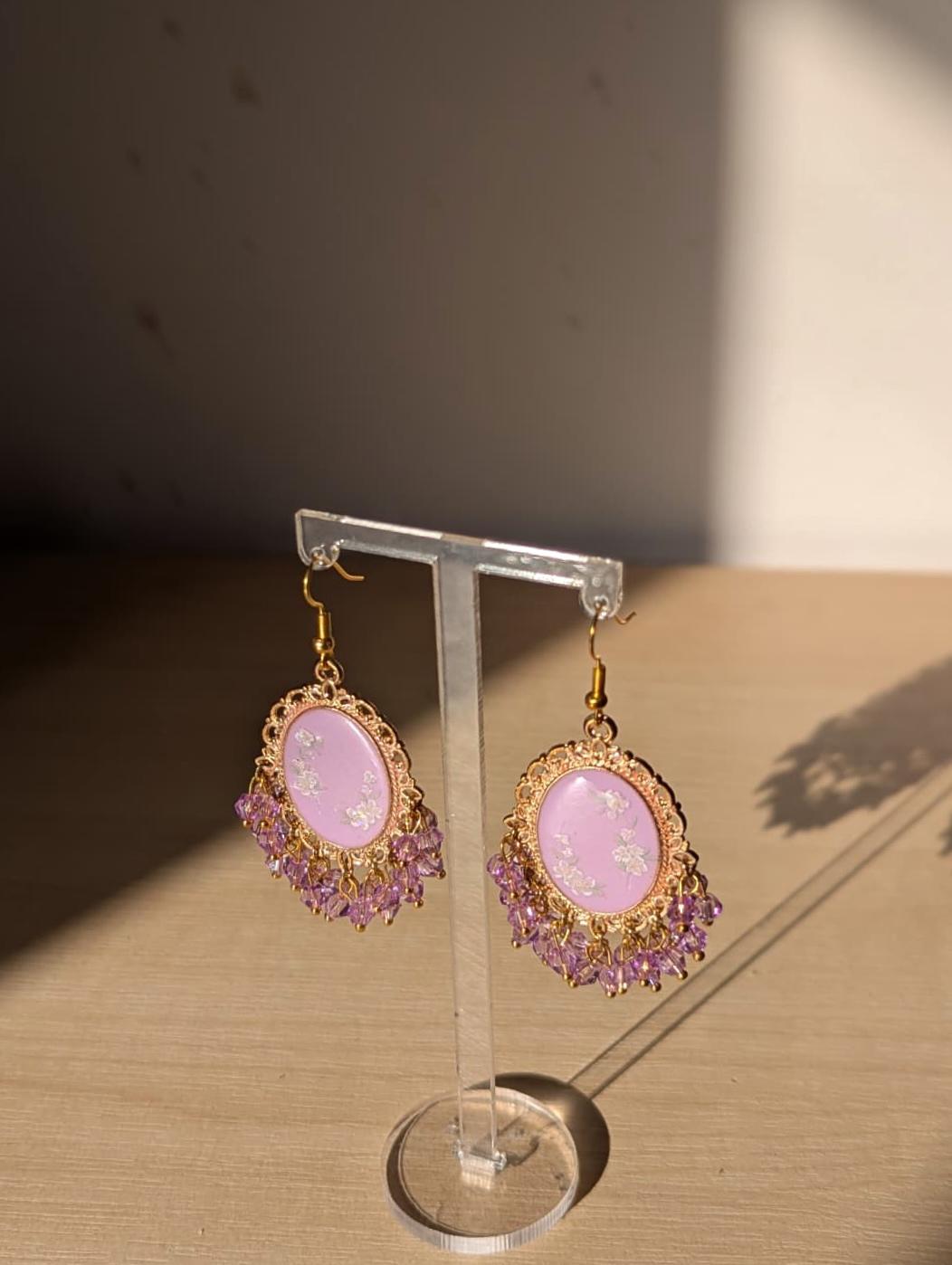 Purple floral resin earrings in gold