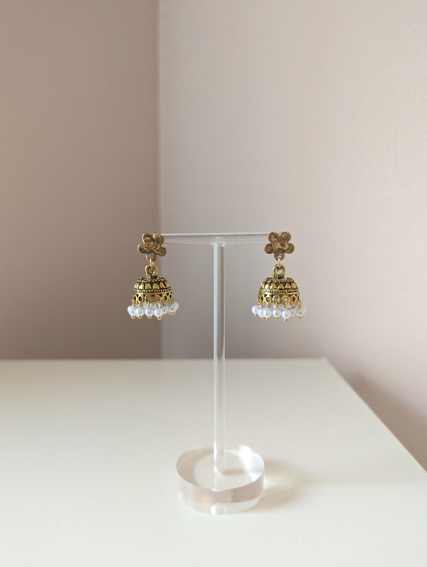 Gold floral jhumka with white pearls