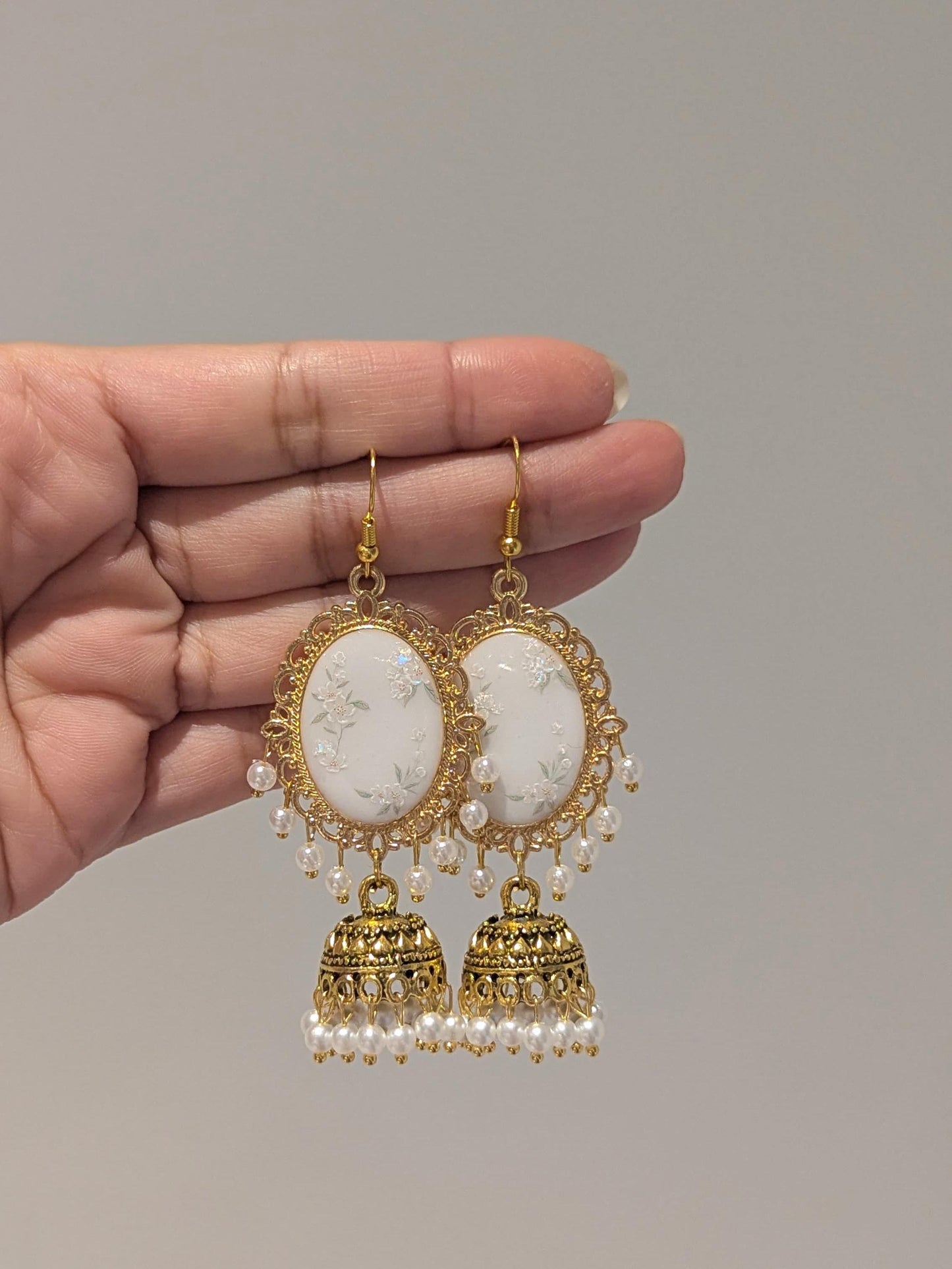White Floral Jhumkay in Gold
