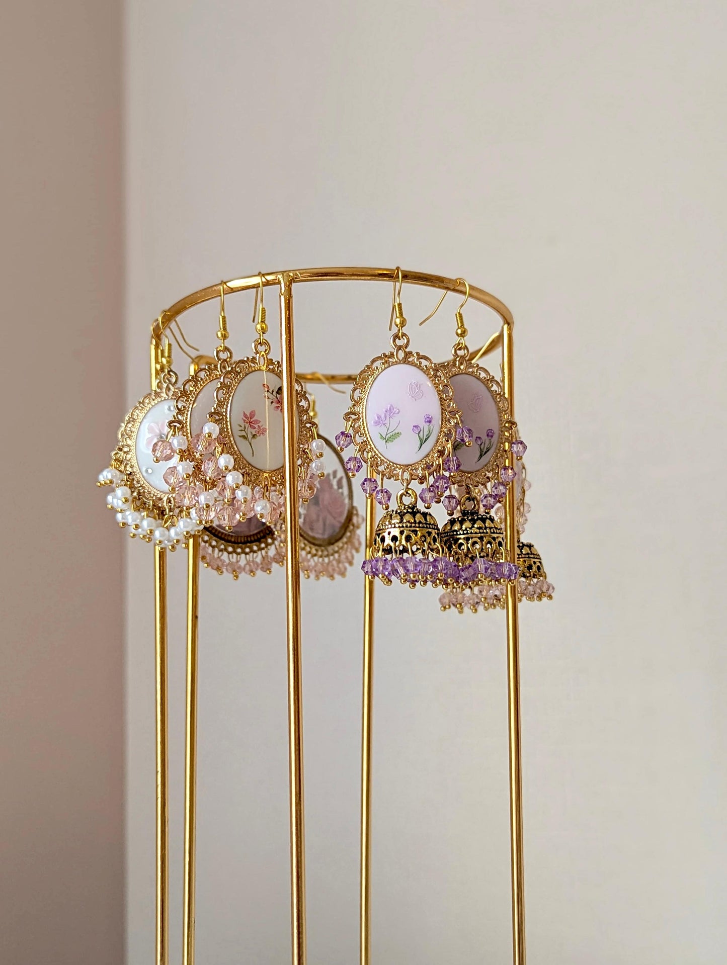 Purple on purple floral jhumkay drop earrings in gold