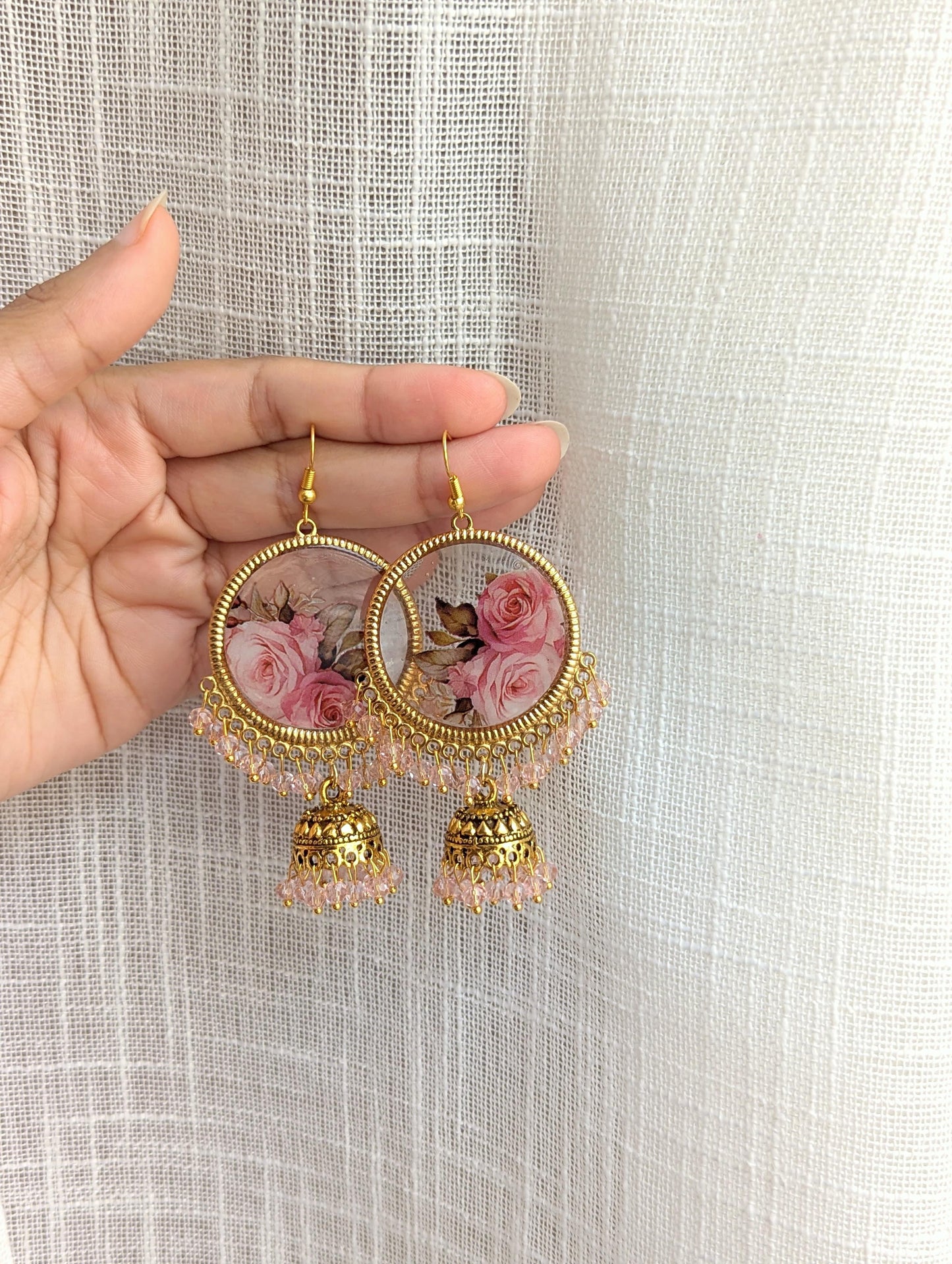 Pink flowers resin jhumka earrings