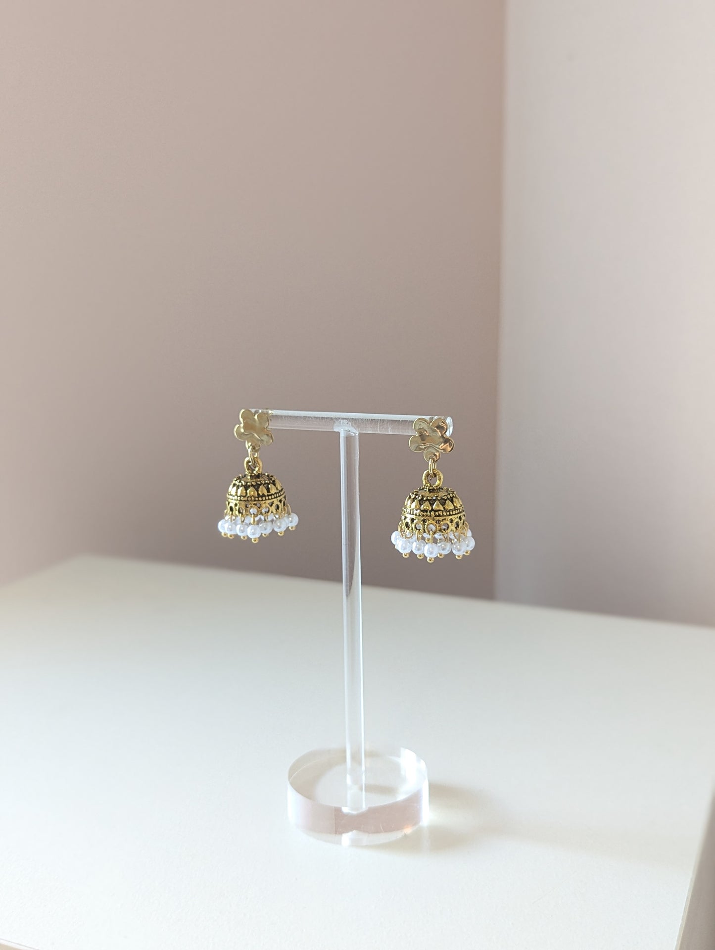 Gold floral jhumka with white pearls