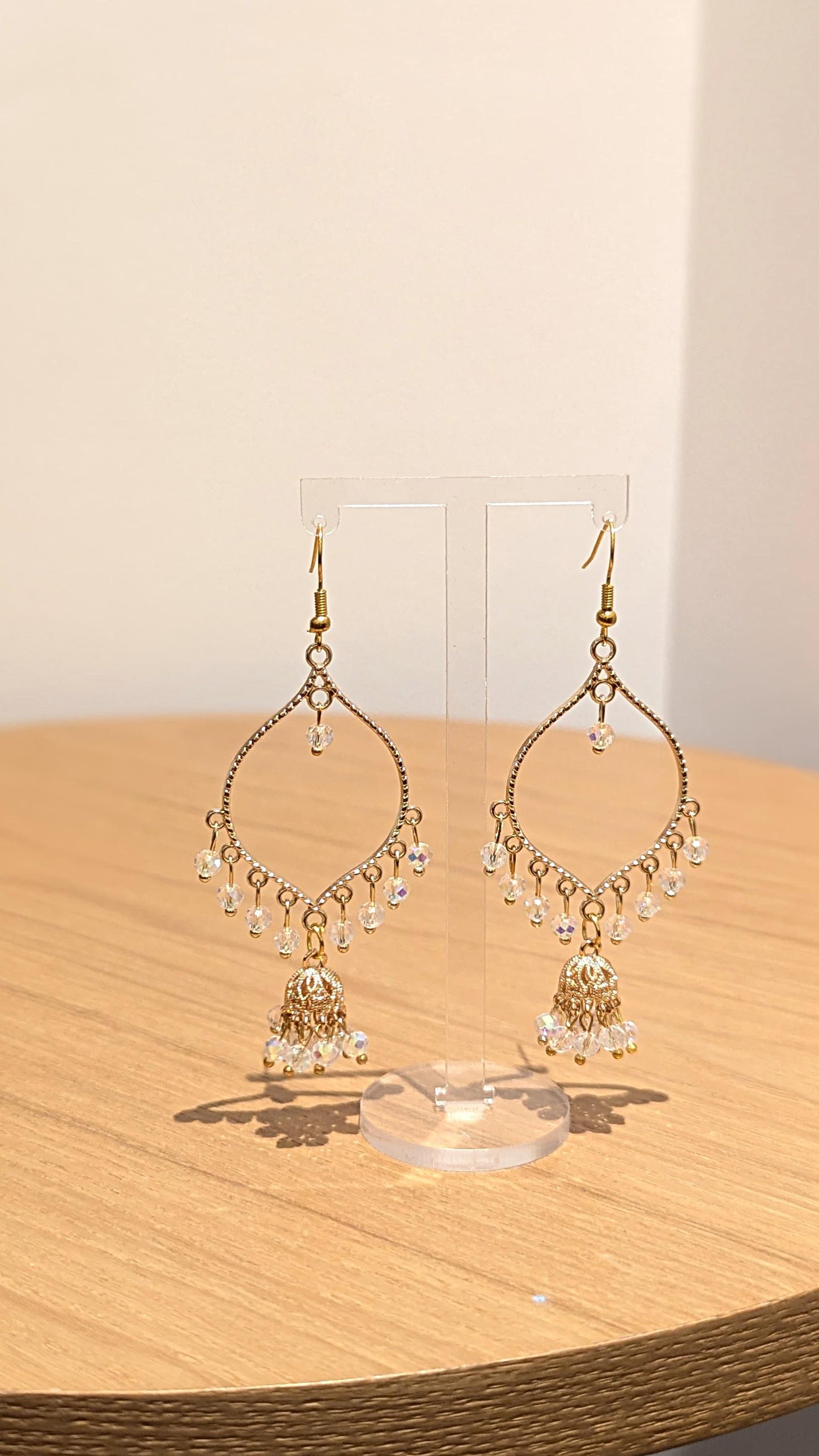 Jhumka drop earrings in gold and crystal