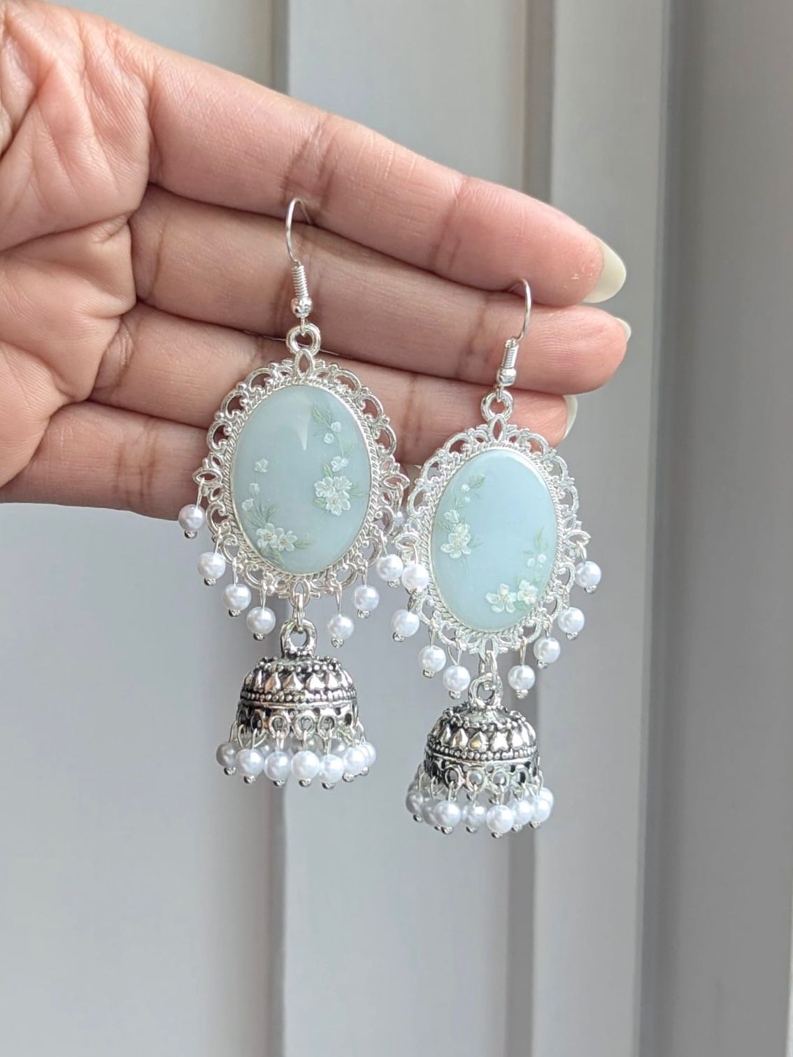 Light Blue White Floral Jhumkas in Silver