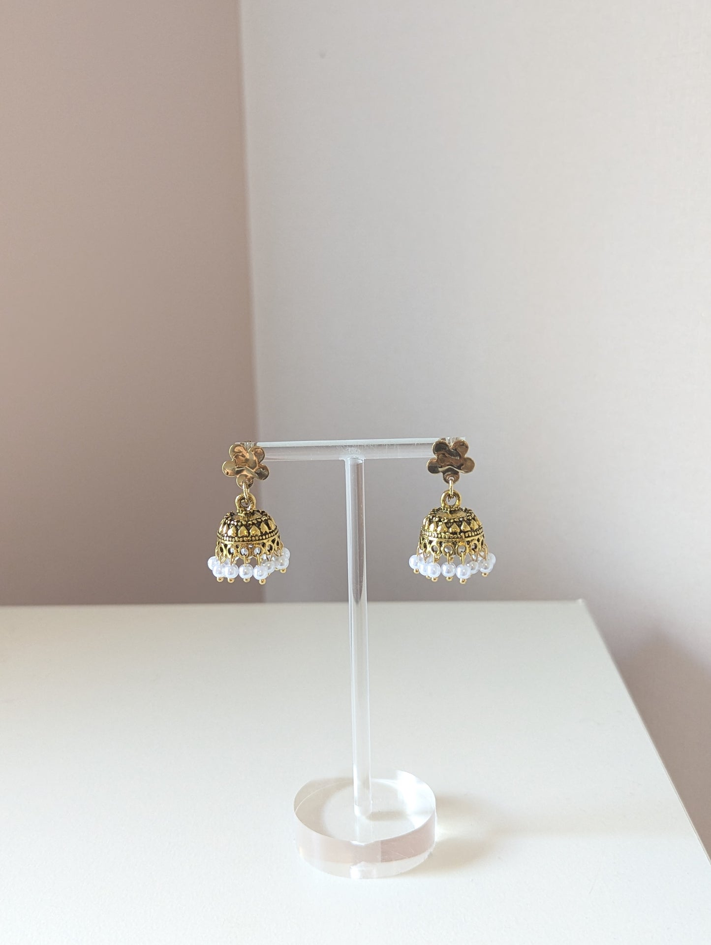 Gold floral jhumka with white pearls
