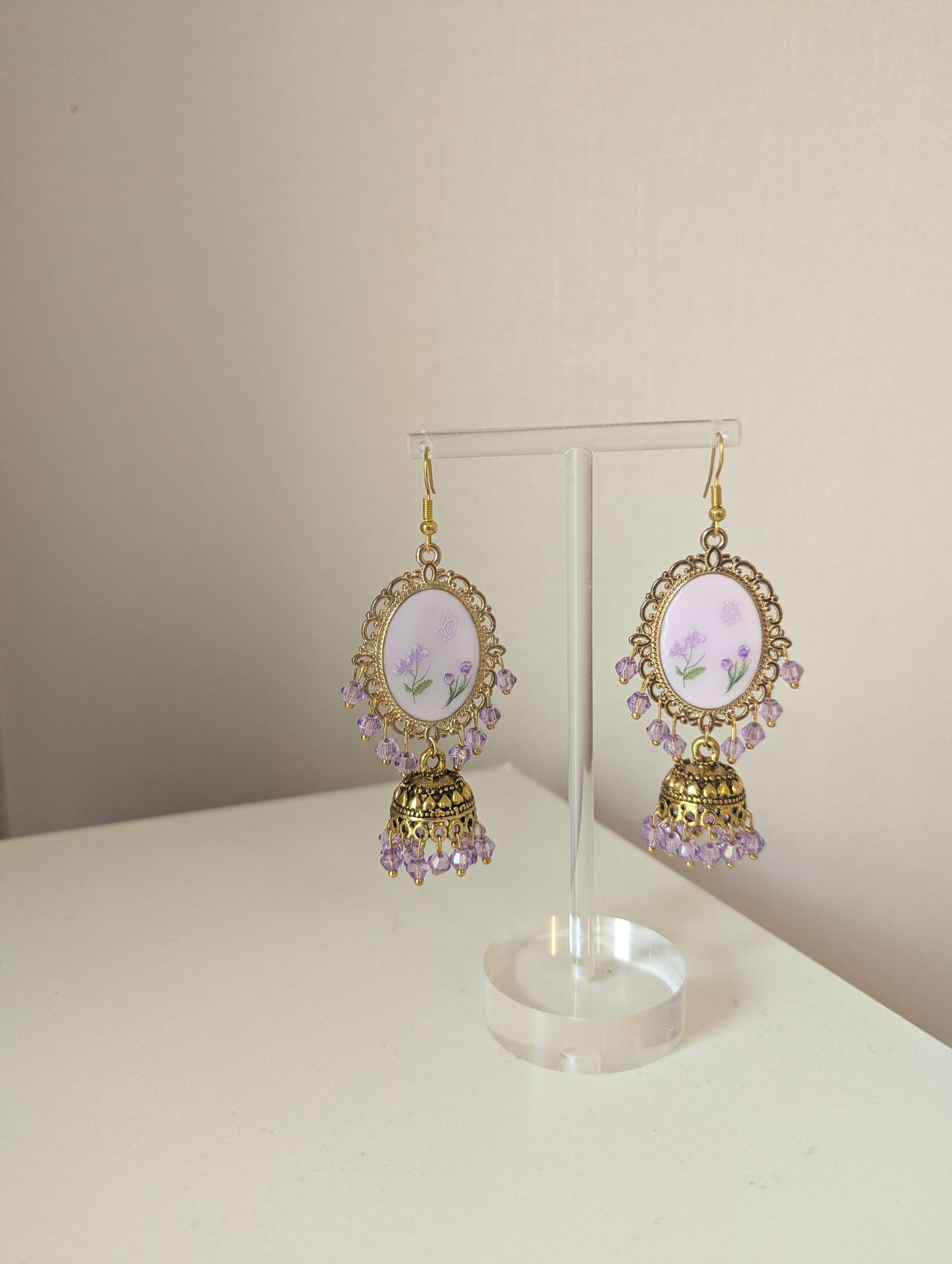 Purple on purple floral jhumkay drop earrings in gold