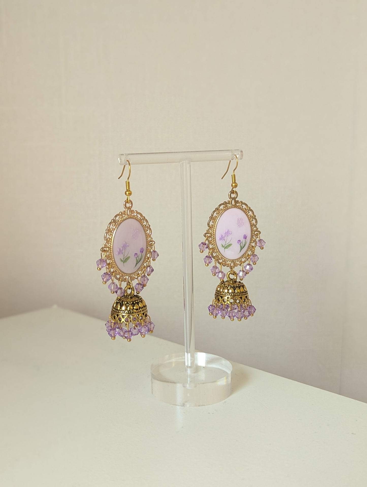 Purple on purple floral jhumkay drop earrings in gold