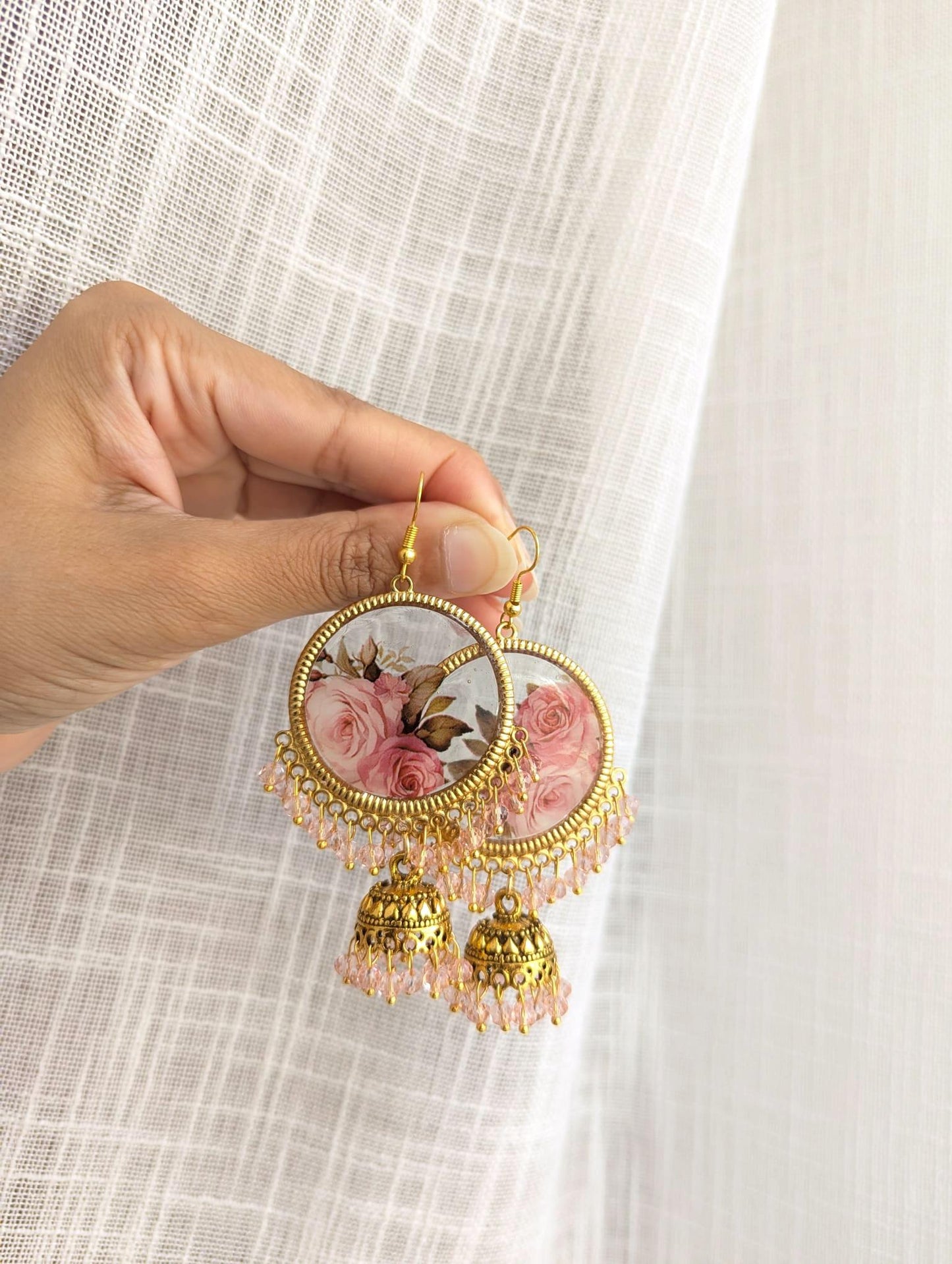 Pink flowers resin jhumka earrings
