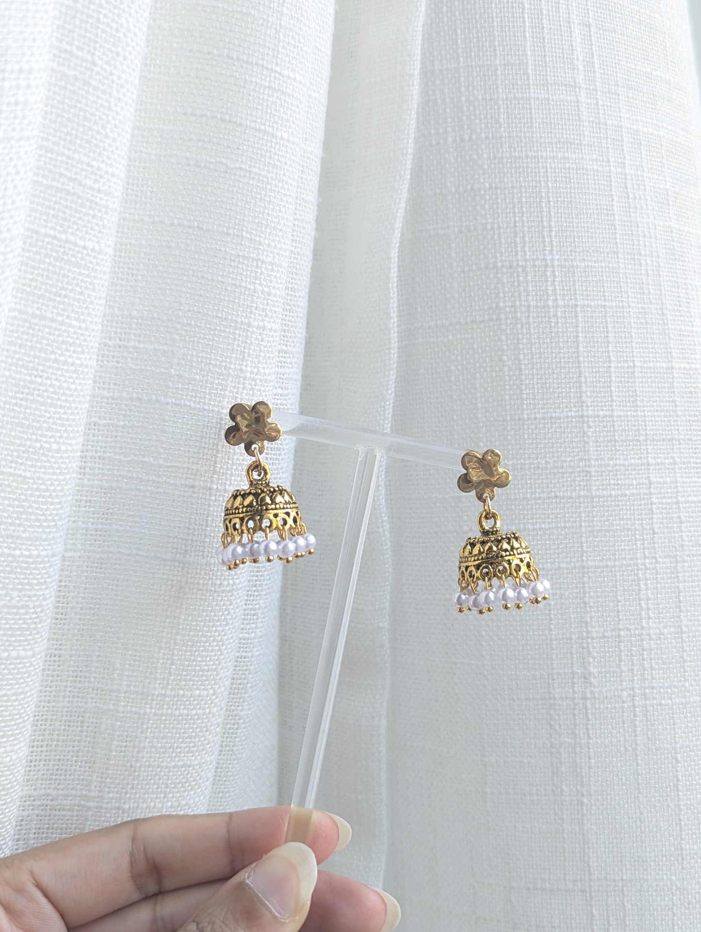 Gold floral jhumka with white pearls