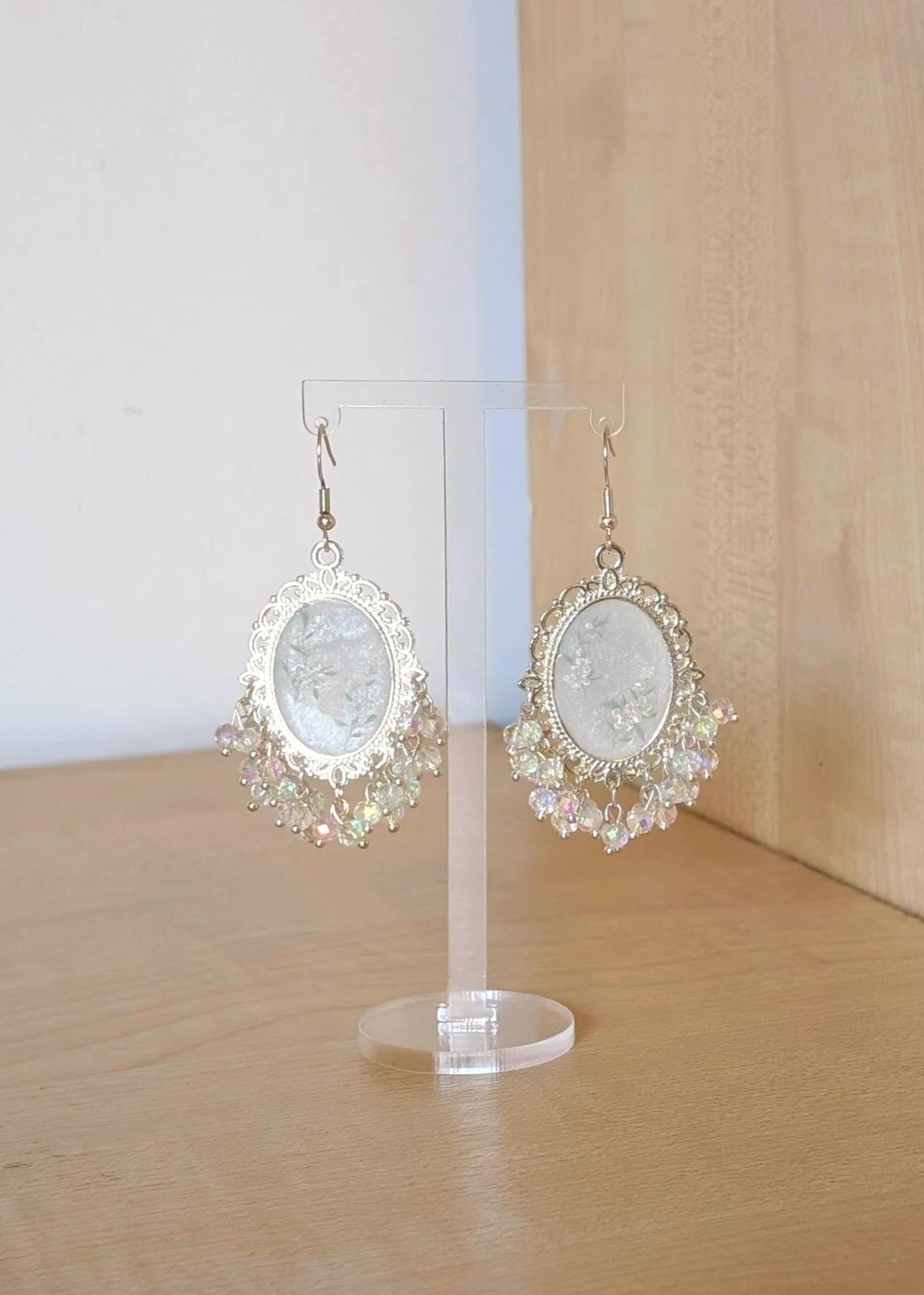 White floral resin earrings in silver