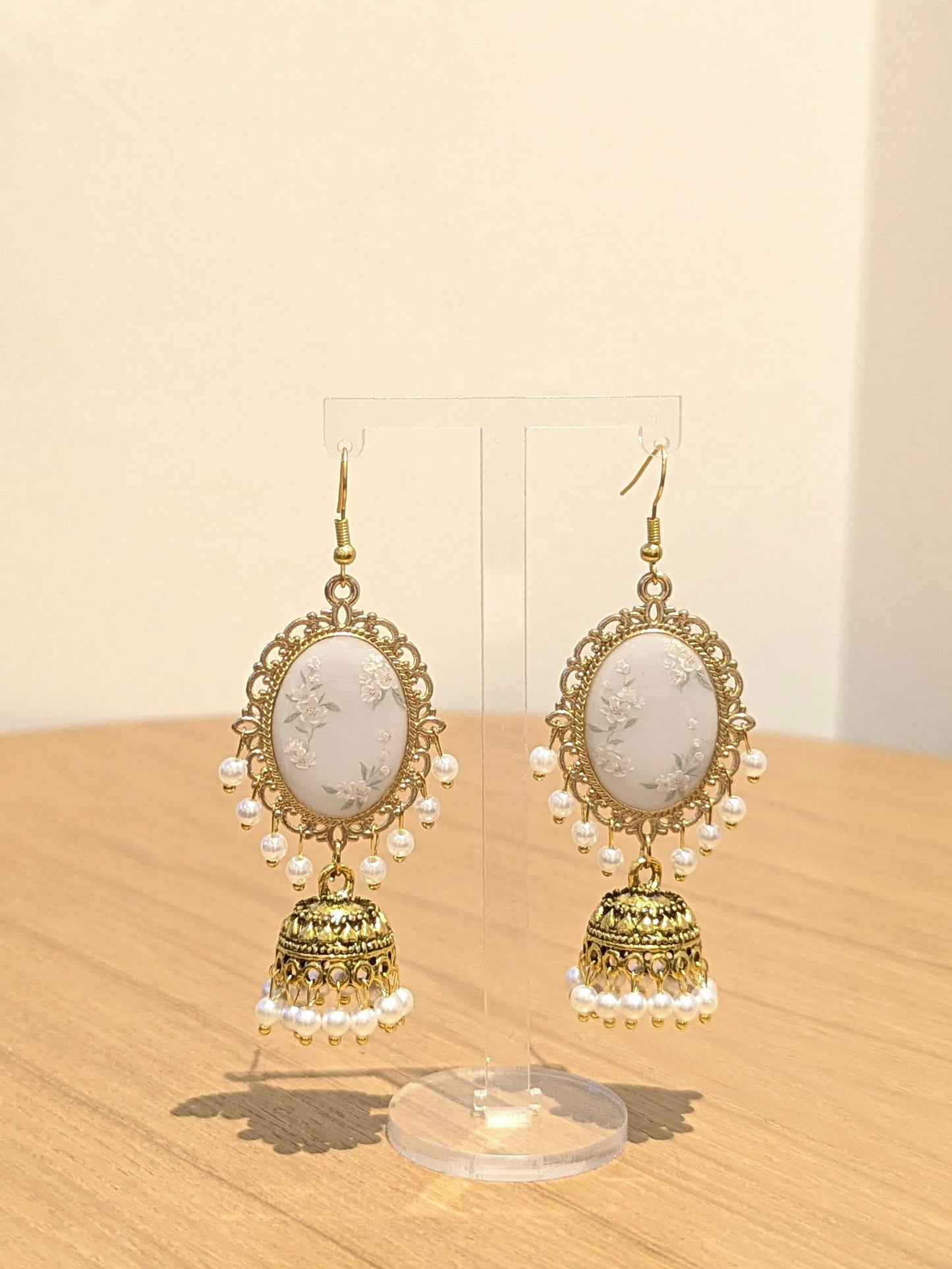 White Floral Jhumkay in Gold