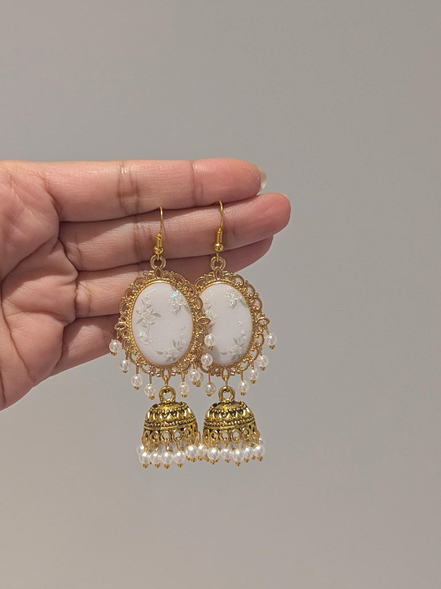 White Floral Jhumkay in Gold