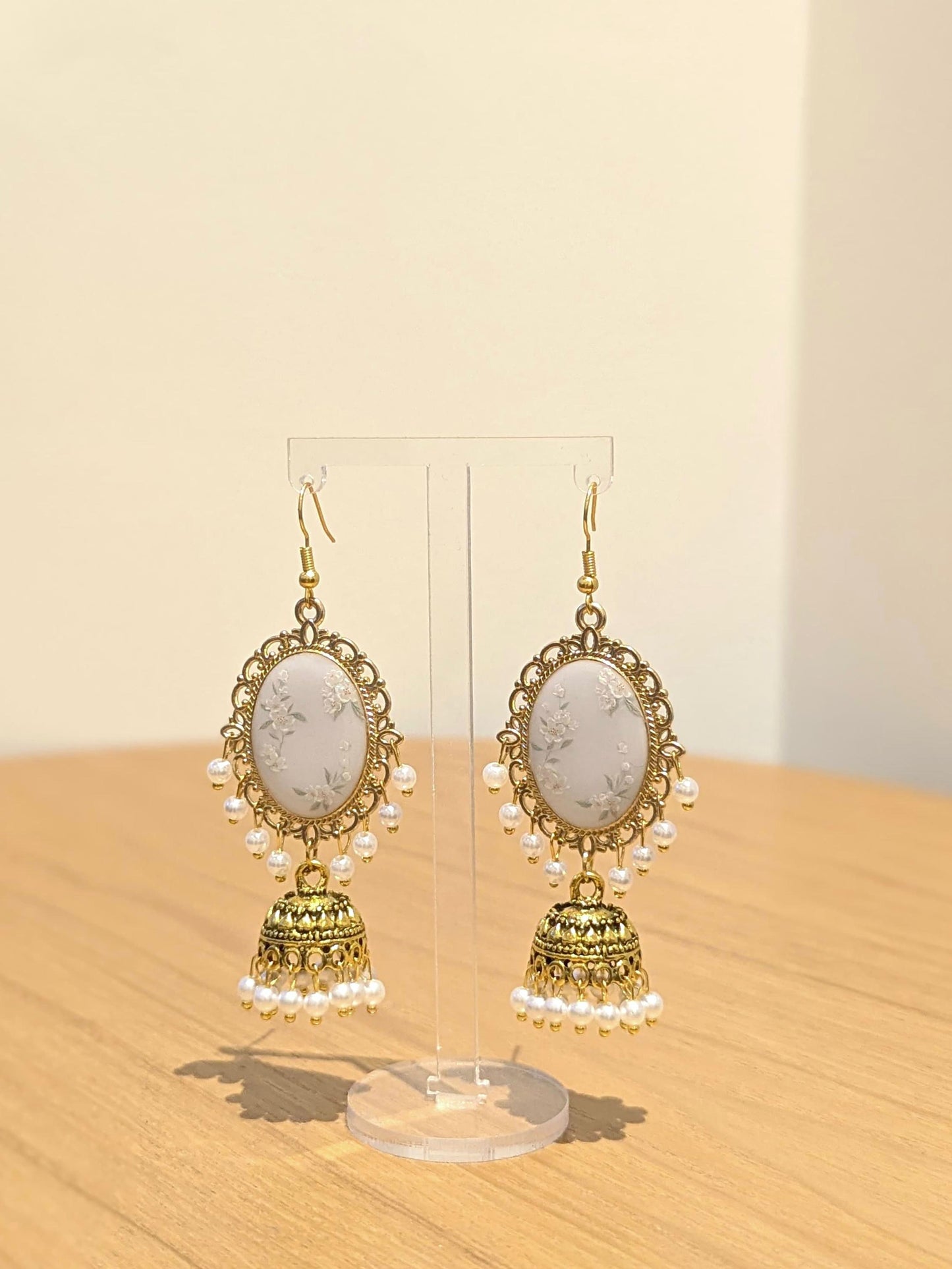 White Floral Jhumkay in Gold