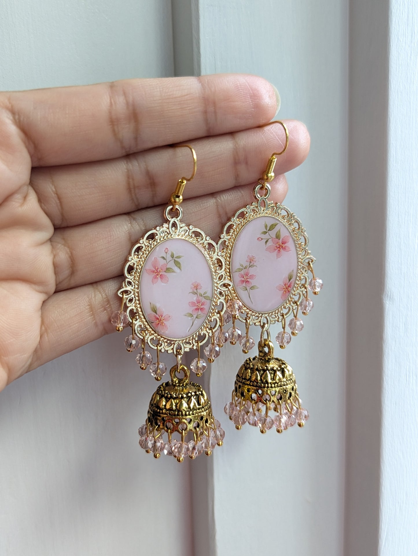 Pink floral jhumka drop earrings in gold