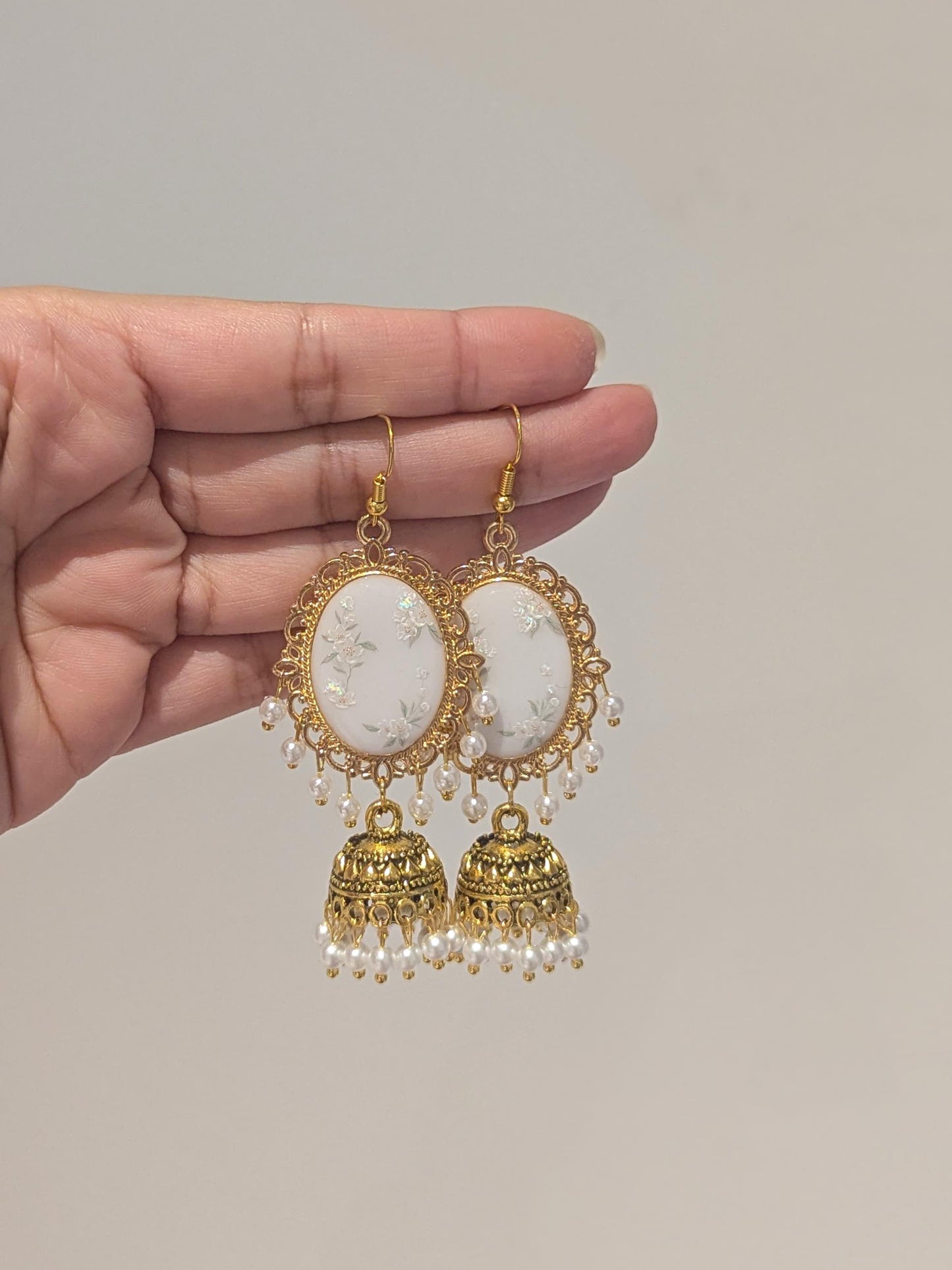 White Floral Jhumkay in Gold