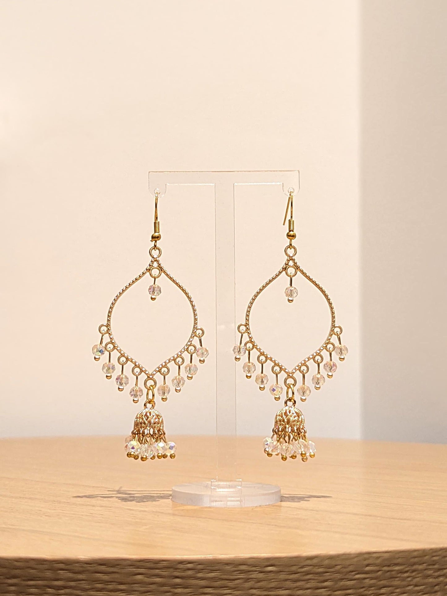 Jhumka drop earrings in gold and crystal
