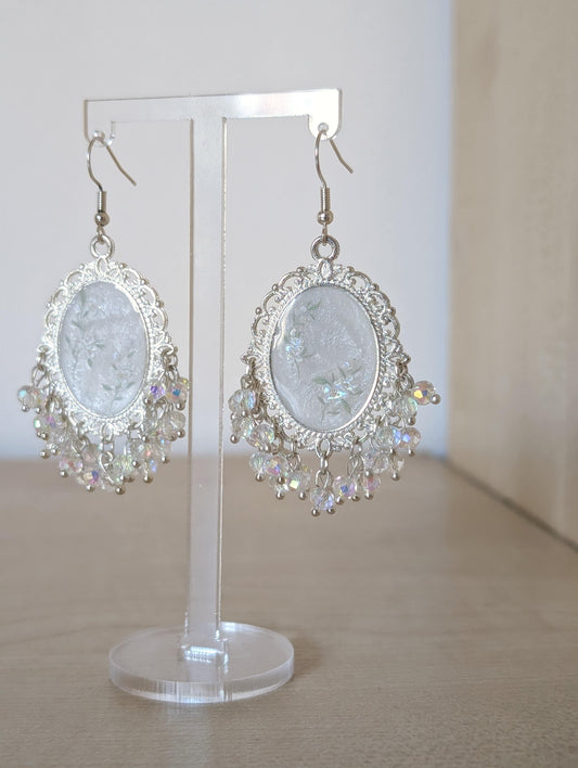 White floral resin earrings in silver
