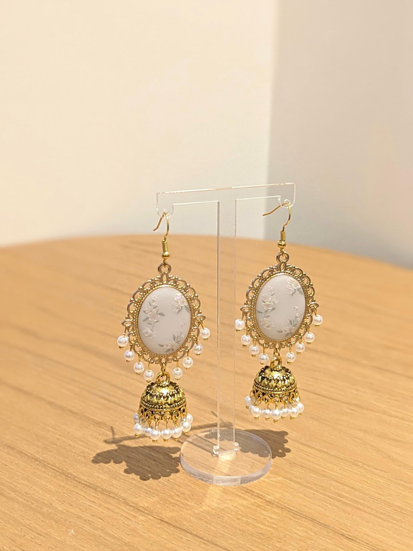 White Floral Jhumkay in Gold