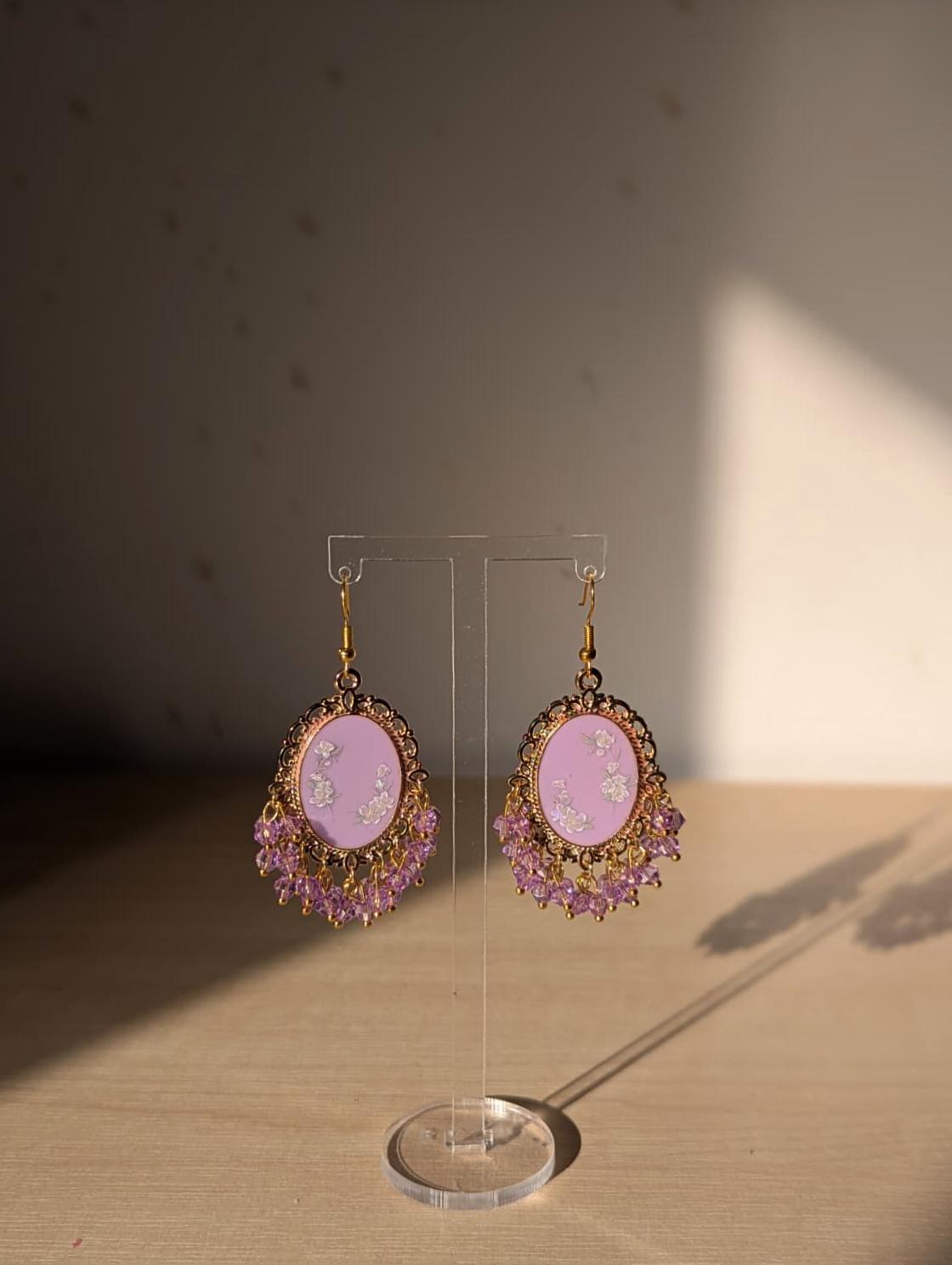 Purple floral resin earrings in gold