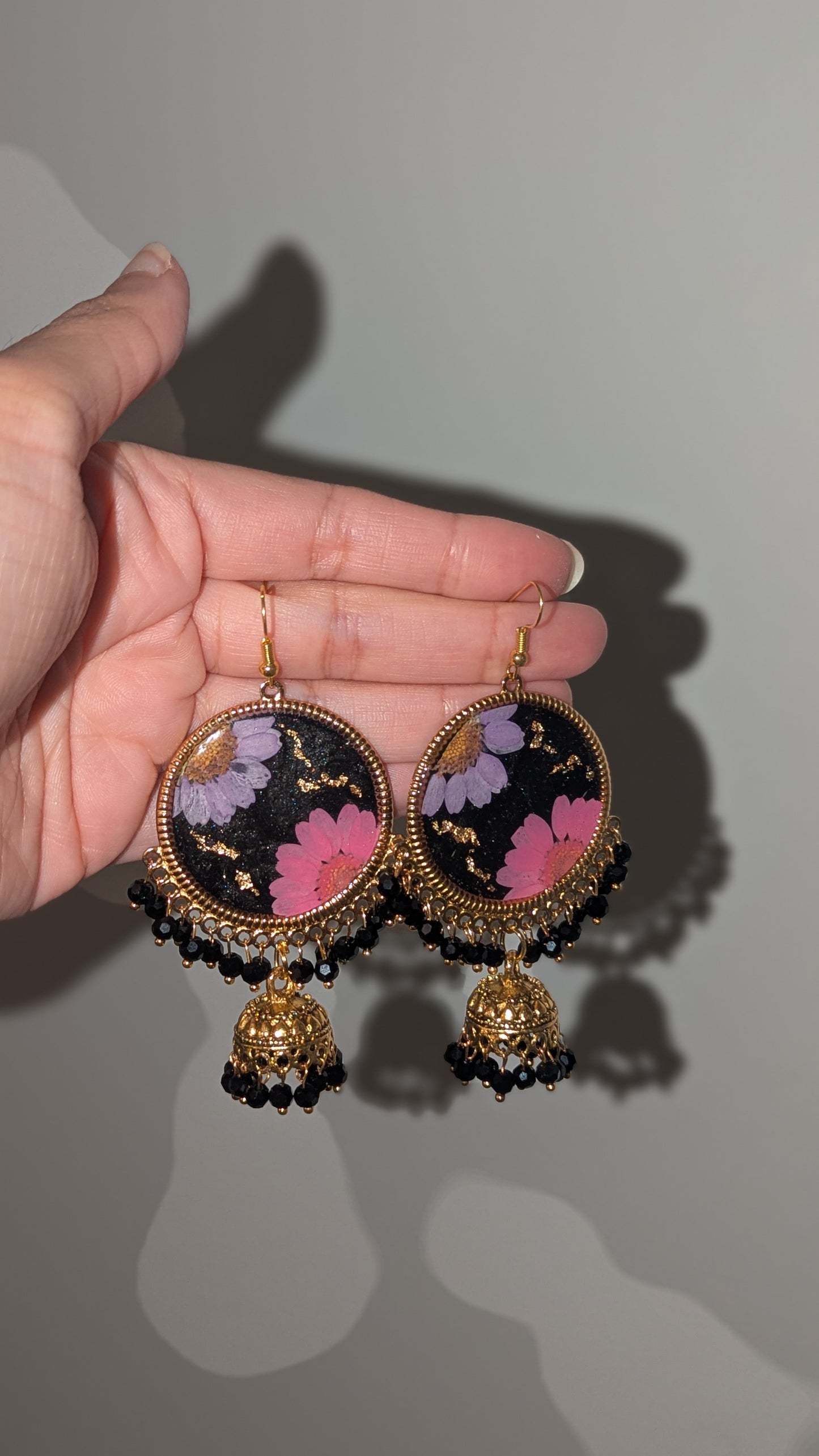 Dreamy Floral Black Jhumkas in Gold