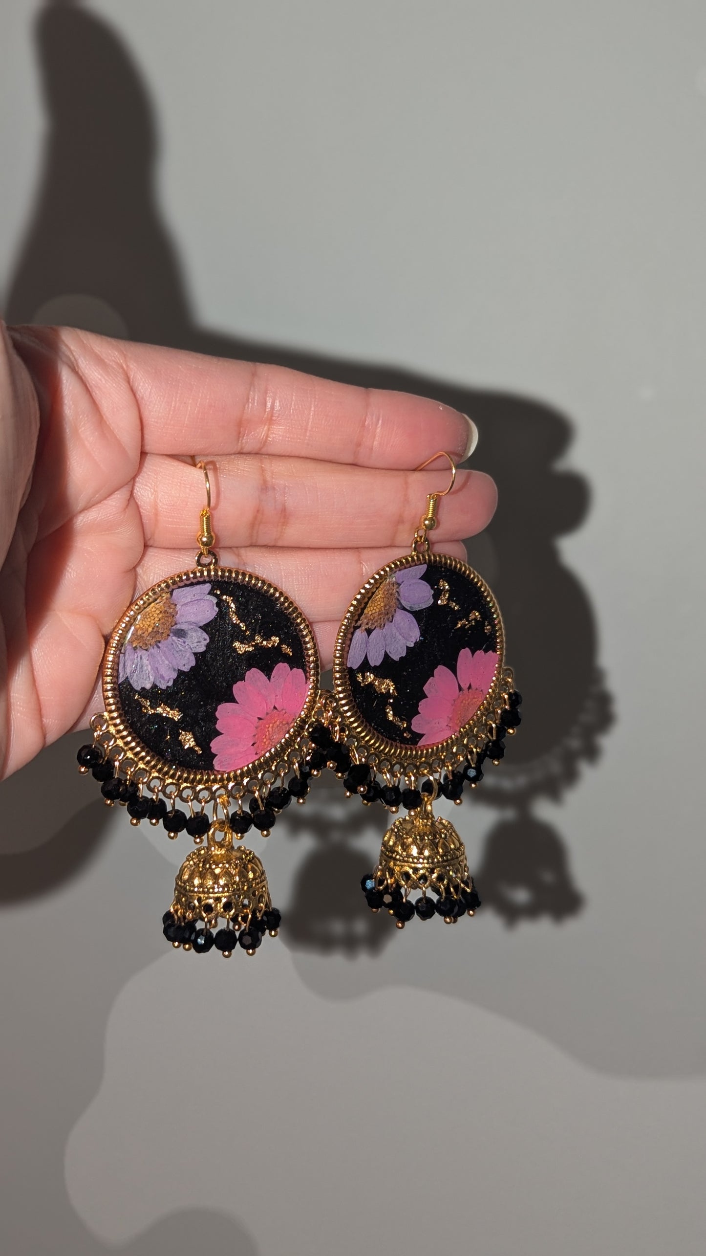 Dreamy Floral Black Jhumkas in Gold