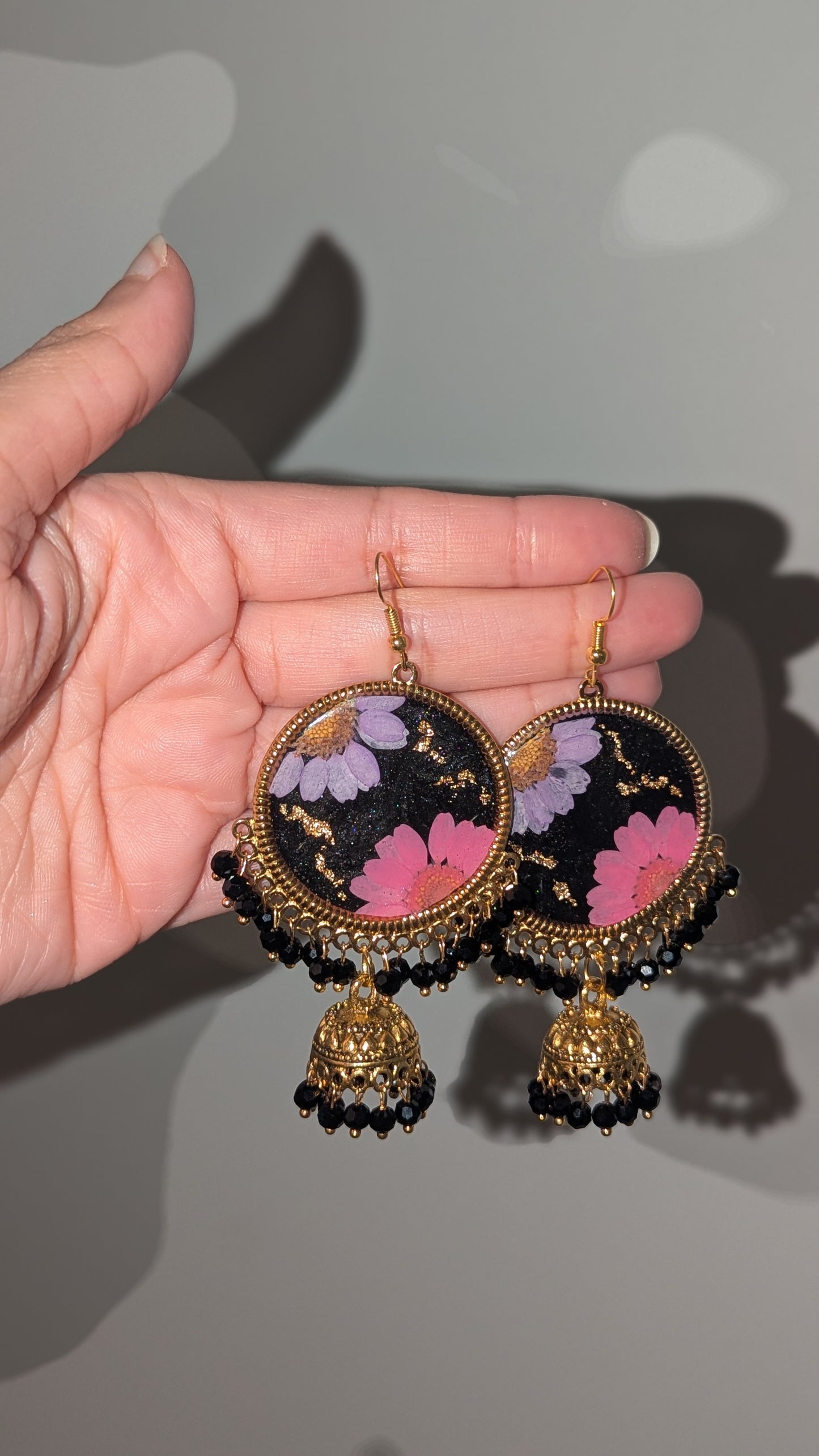Dreamy Floral Black Jhumkas in Gold