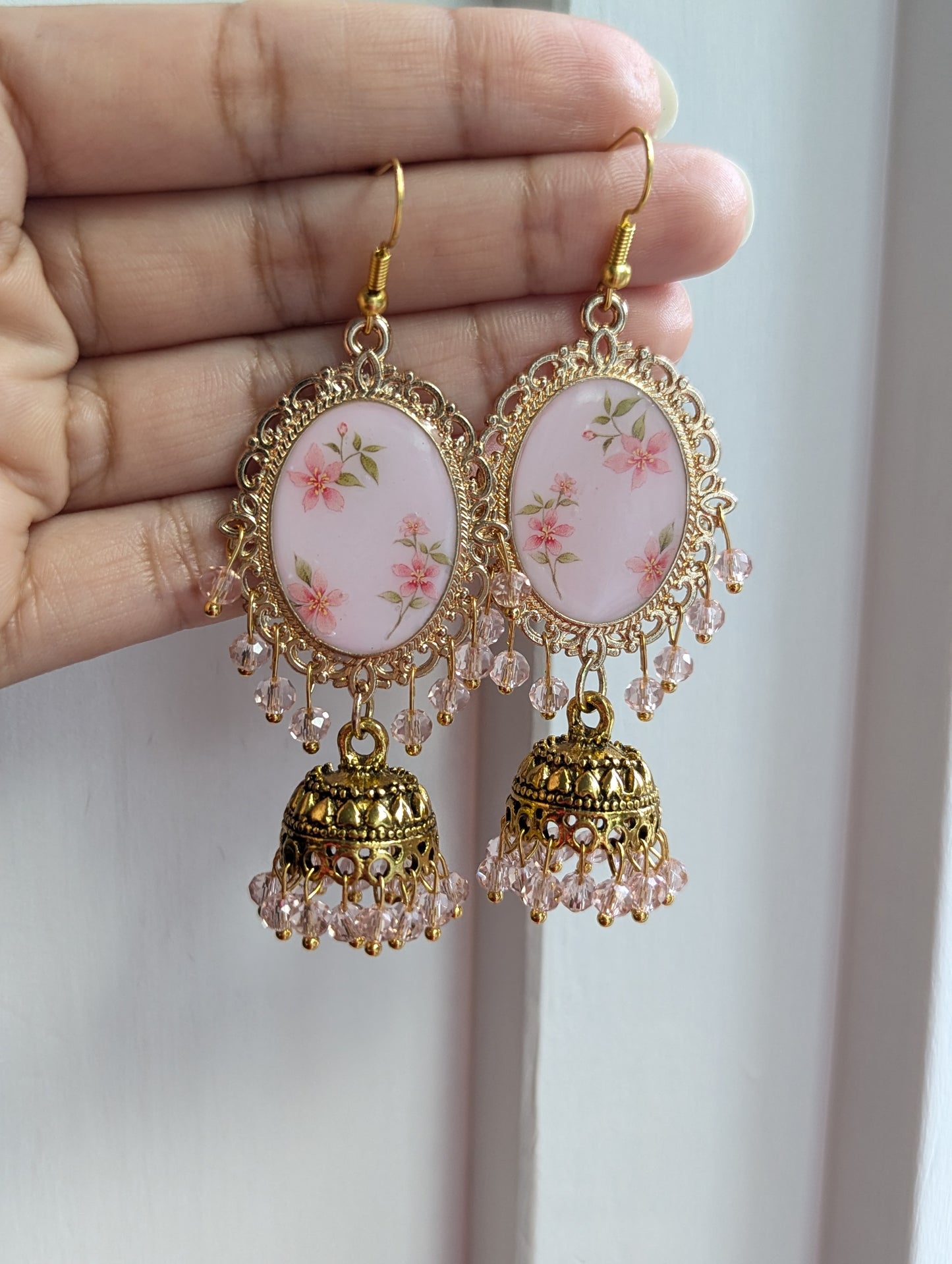 Pink floral jhumka drop earrings in gold