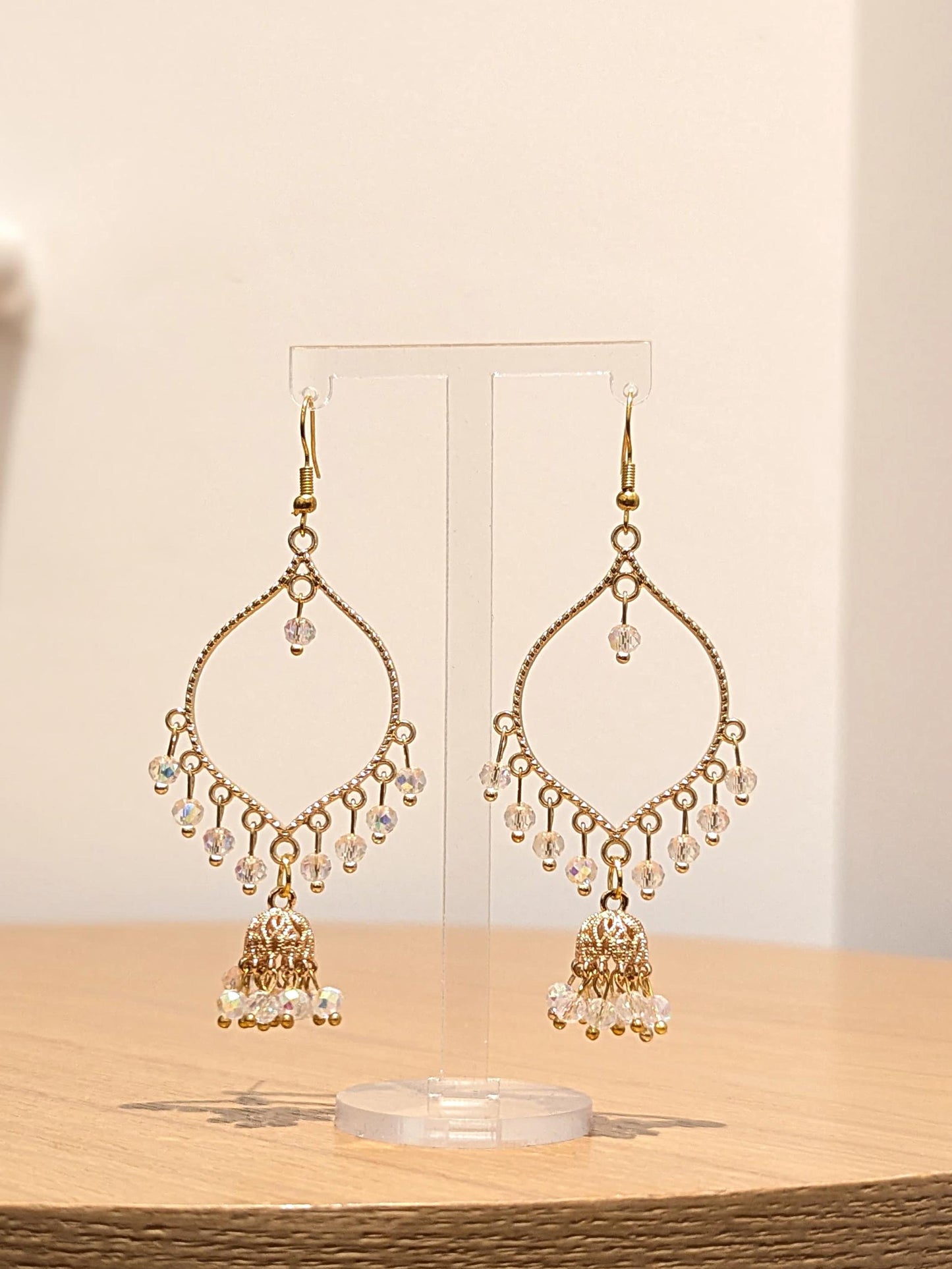 Jhumka drop earrings in gold and crystal