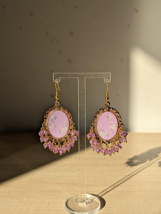 Purple floral resin earrings in gold