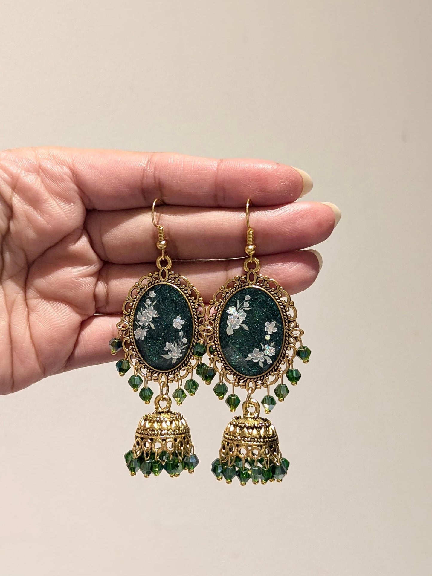 Green jhumka tikka set in gold bronze
