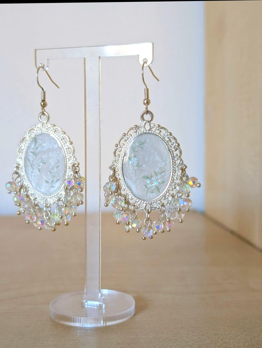 White floral resin earrings in silver