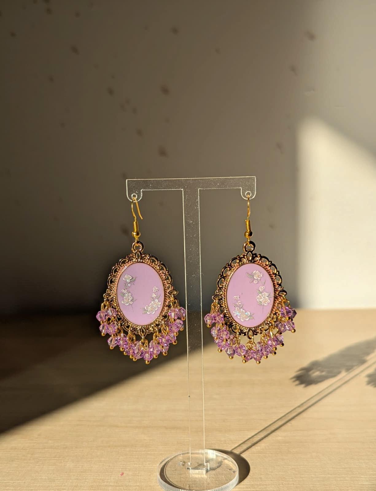 Purple floral resin earrings in gold