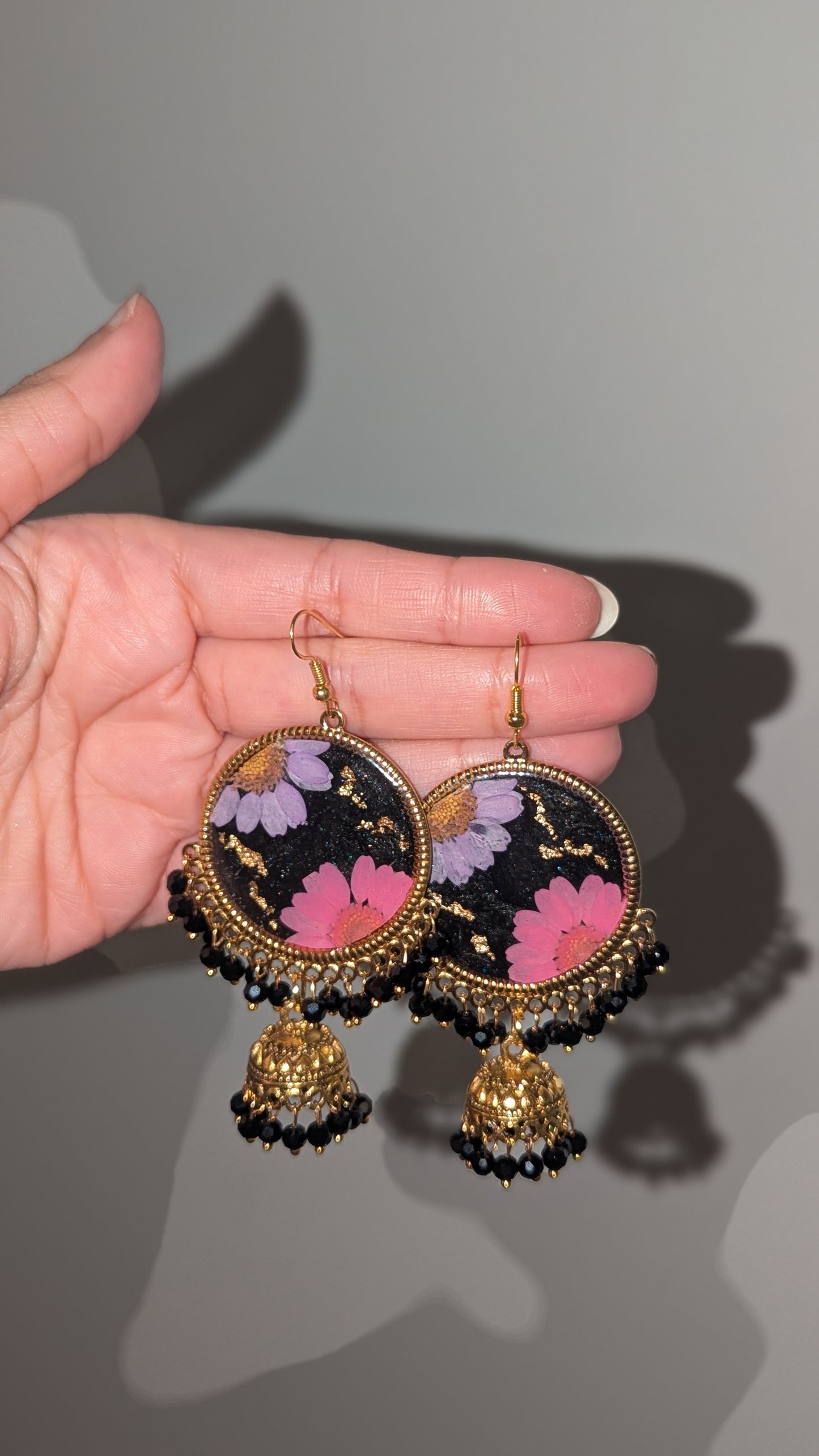 Dreamy Floral Black Jhumkas in Gold