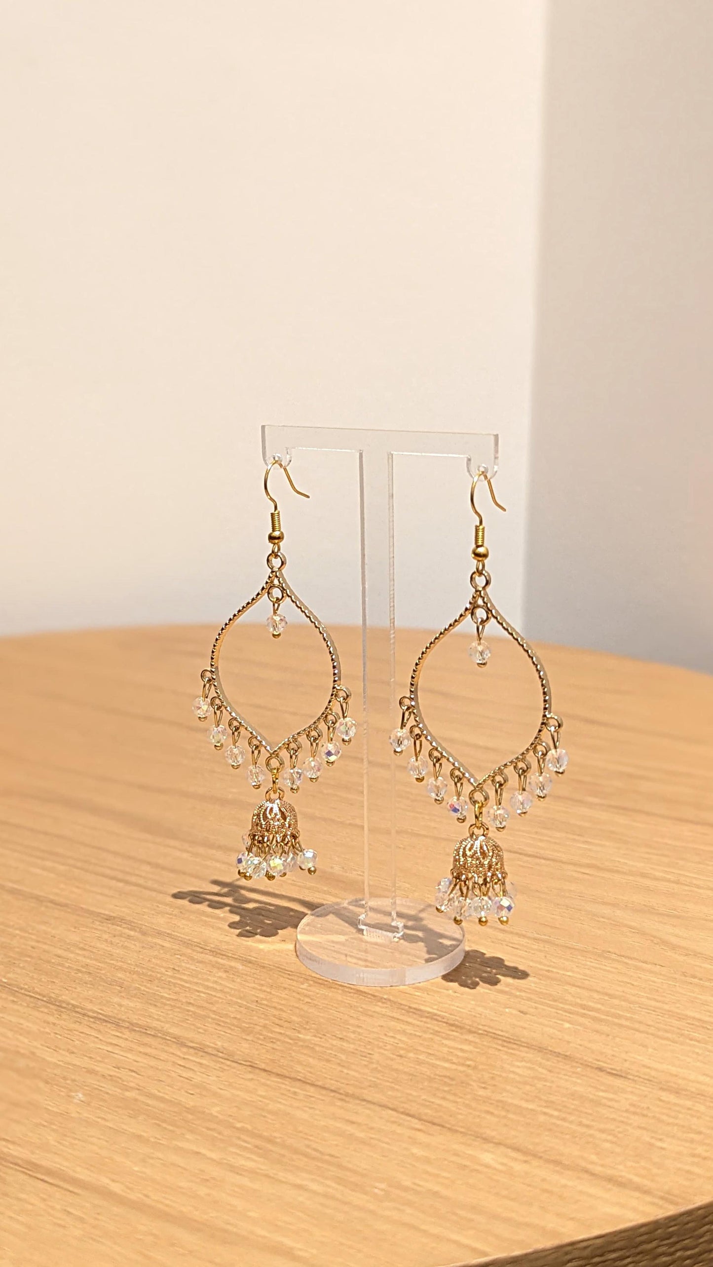 Jhumka drop earrings in gold and crystal