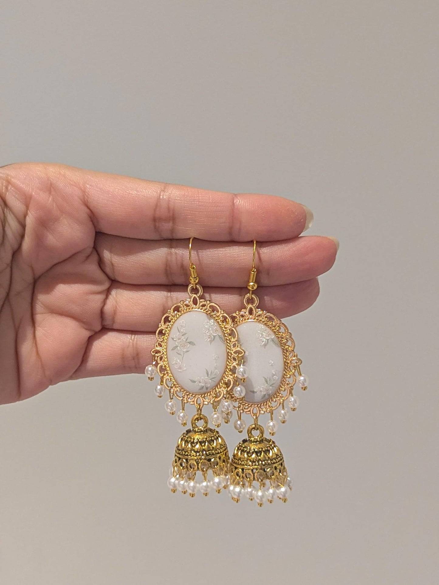 White Floral Jhumkay in Gold