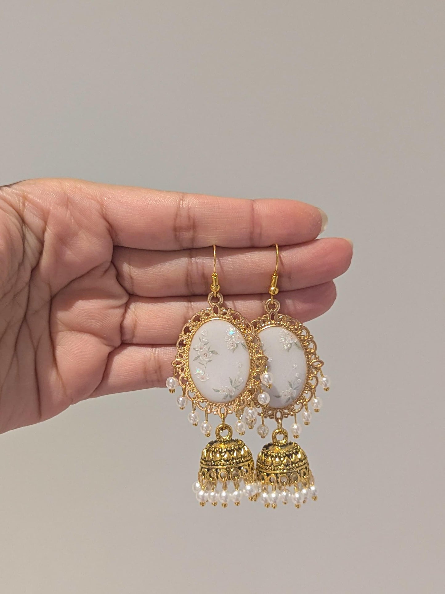 White Floral Jhumkay in Gold