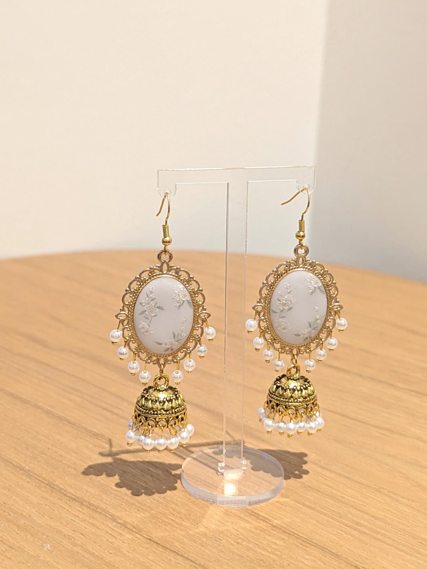 White Floral Jhumkay in Gold