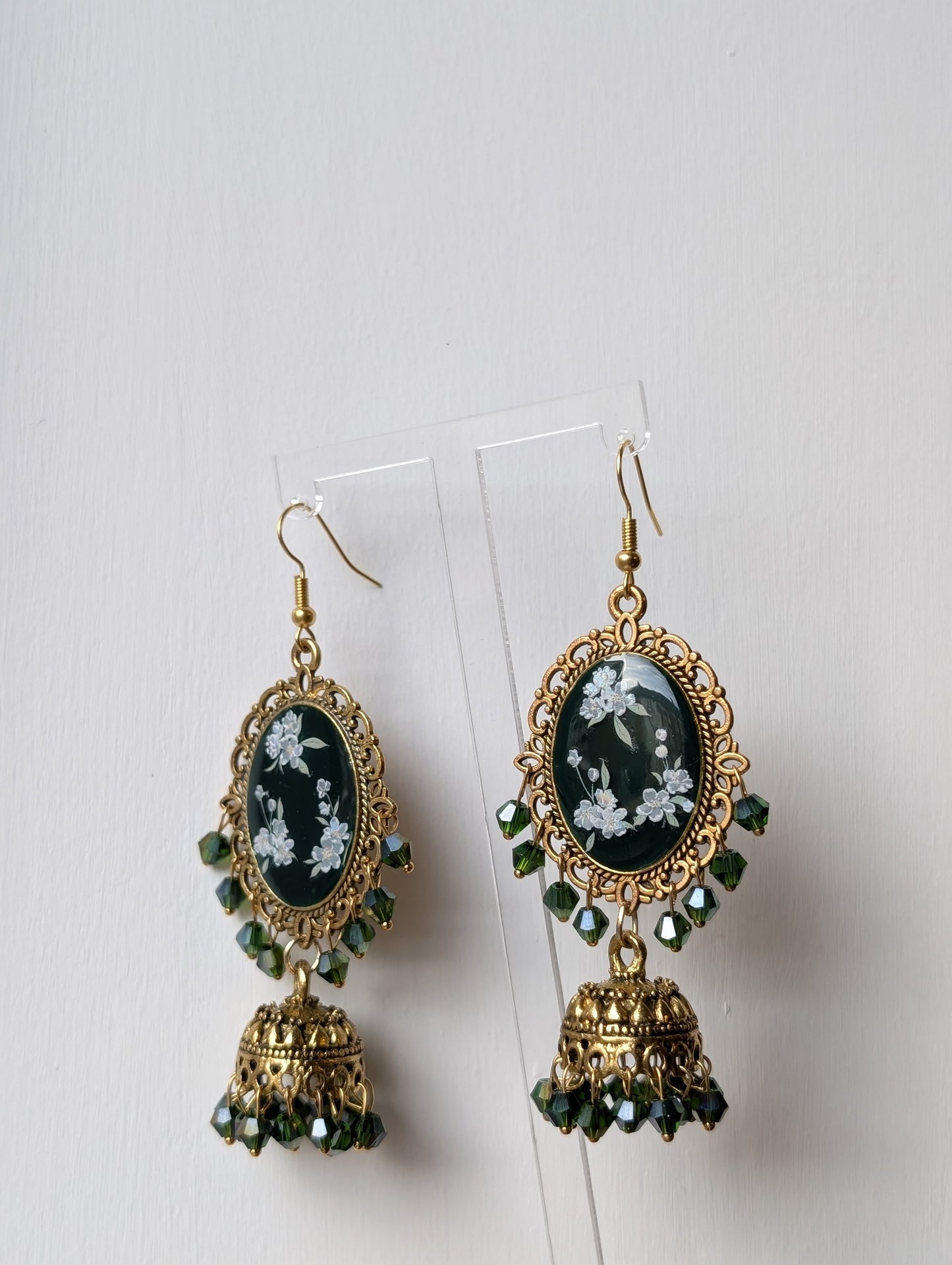 Green floral resin jhumka earrings