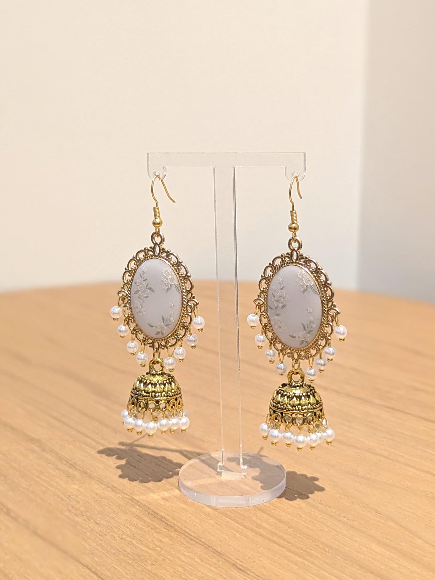 White Floral Jhumkay in Gold