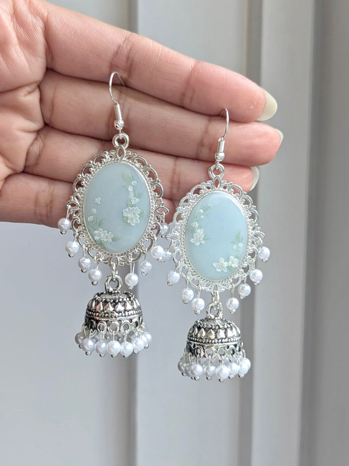 Light Blue White Floral Jhumkas in Silver