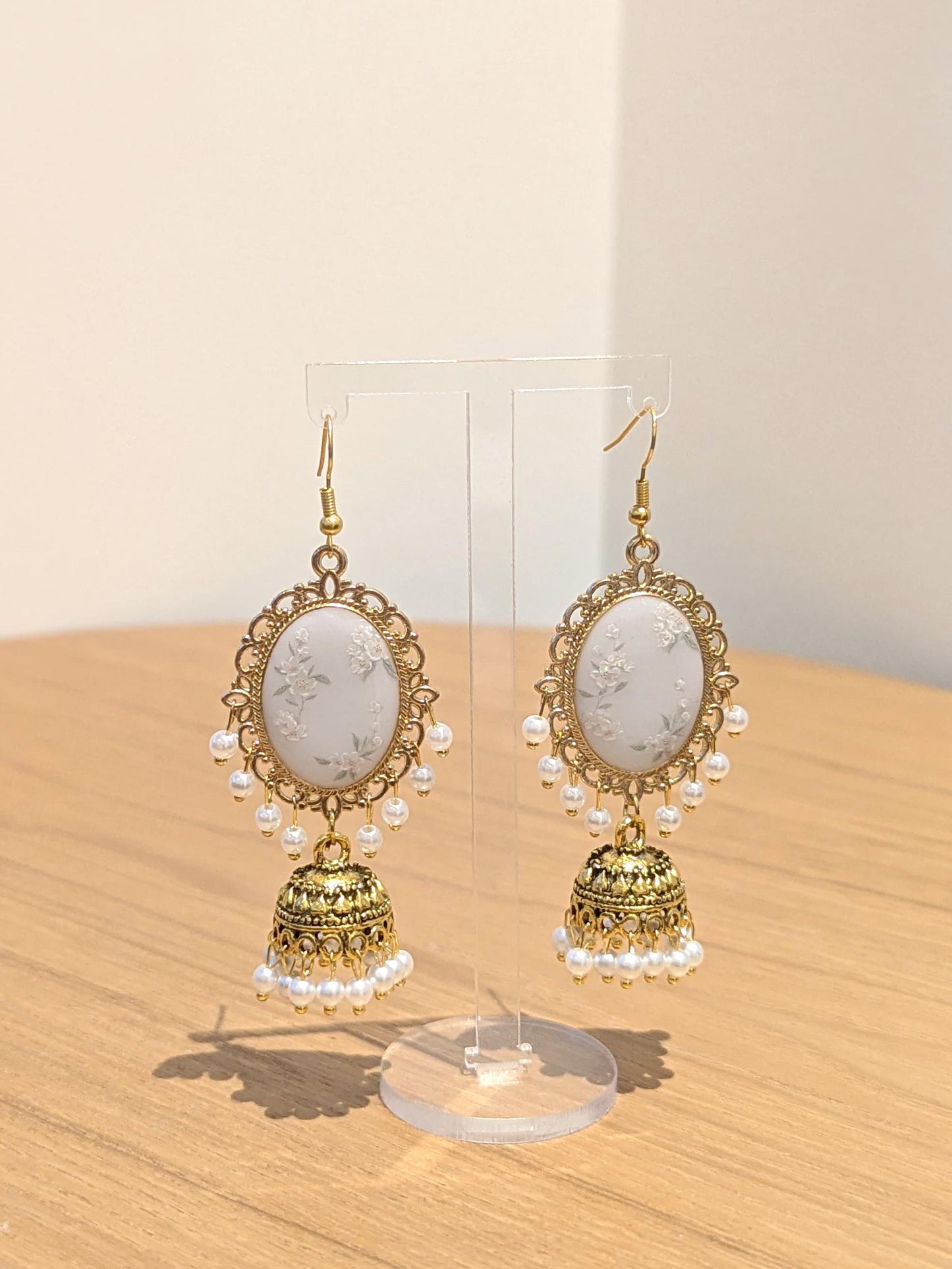 White Floral Jhumkay in Gold