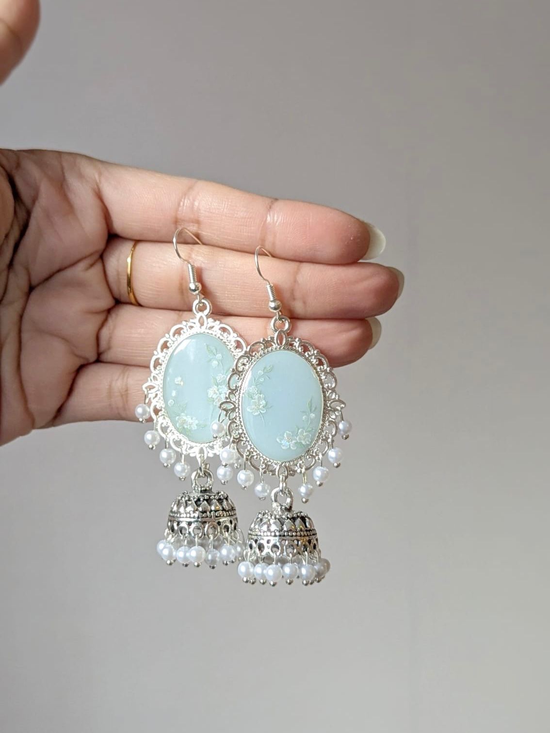 Light Blue White Floral Jhumkas in Silver