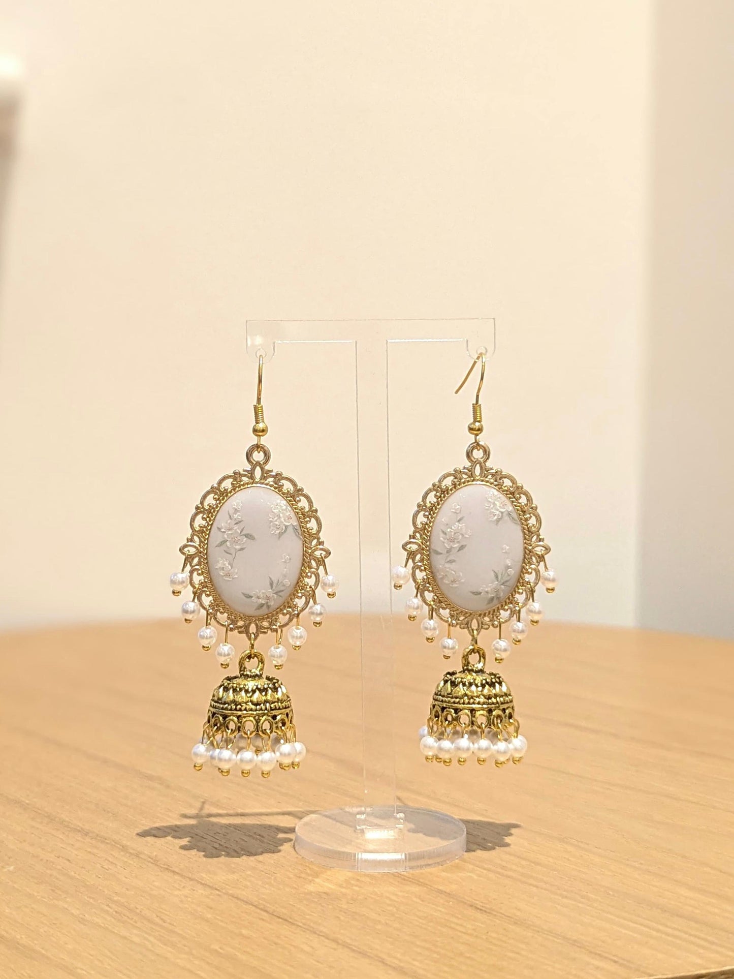 White Floral Jhumkay in Gold